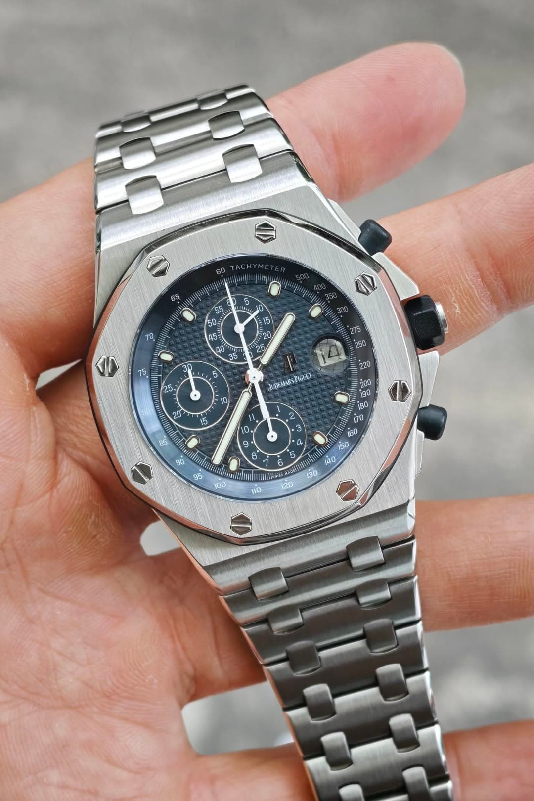 May be an image of wrist watch and text