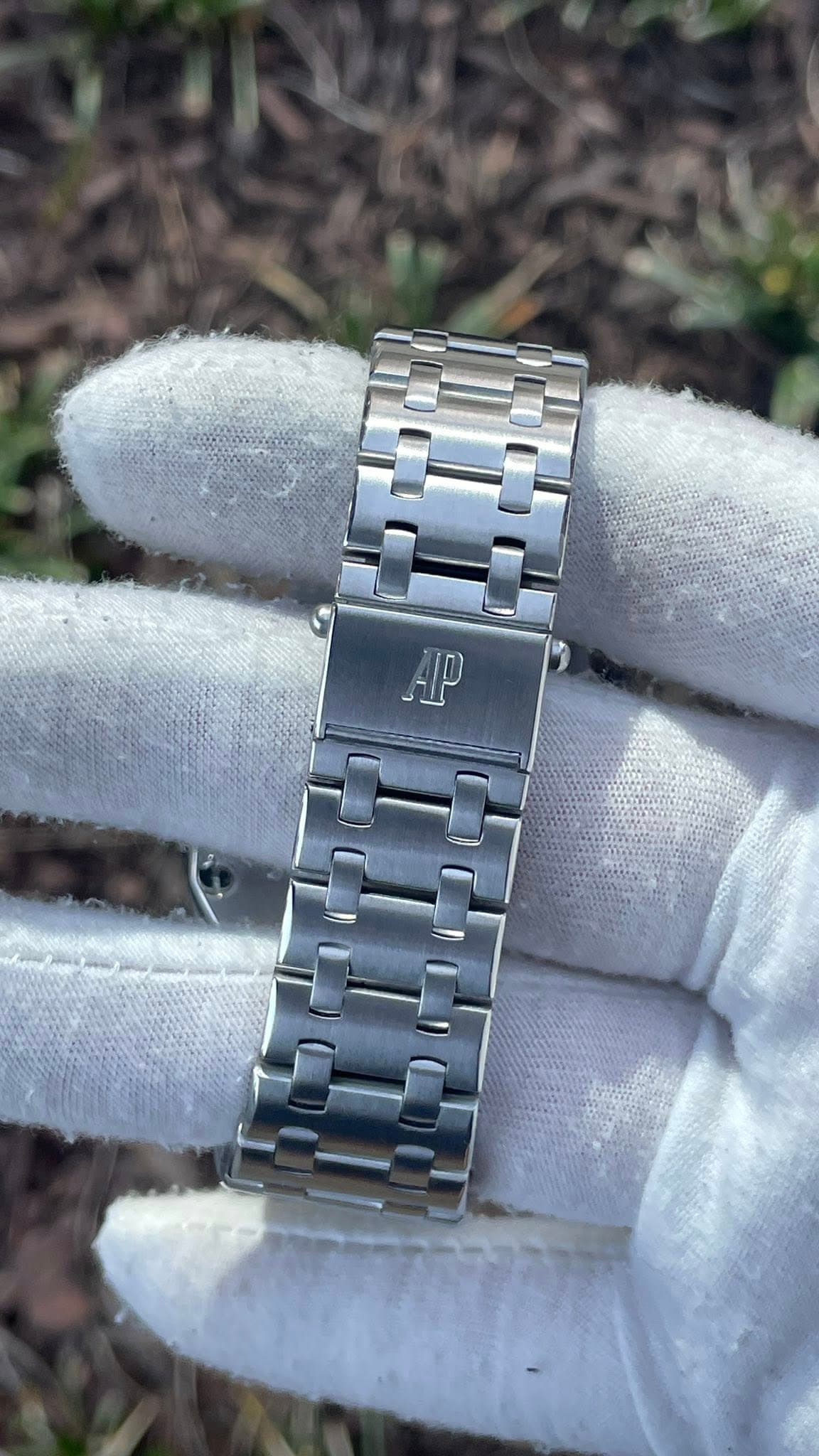May be an image of wrist watch and text that says 'AP'