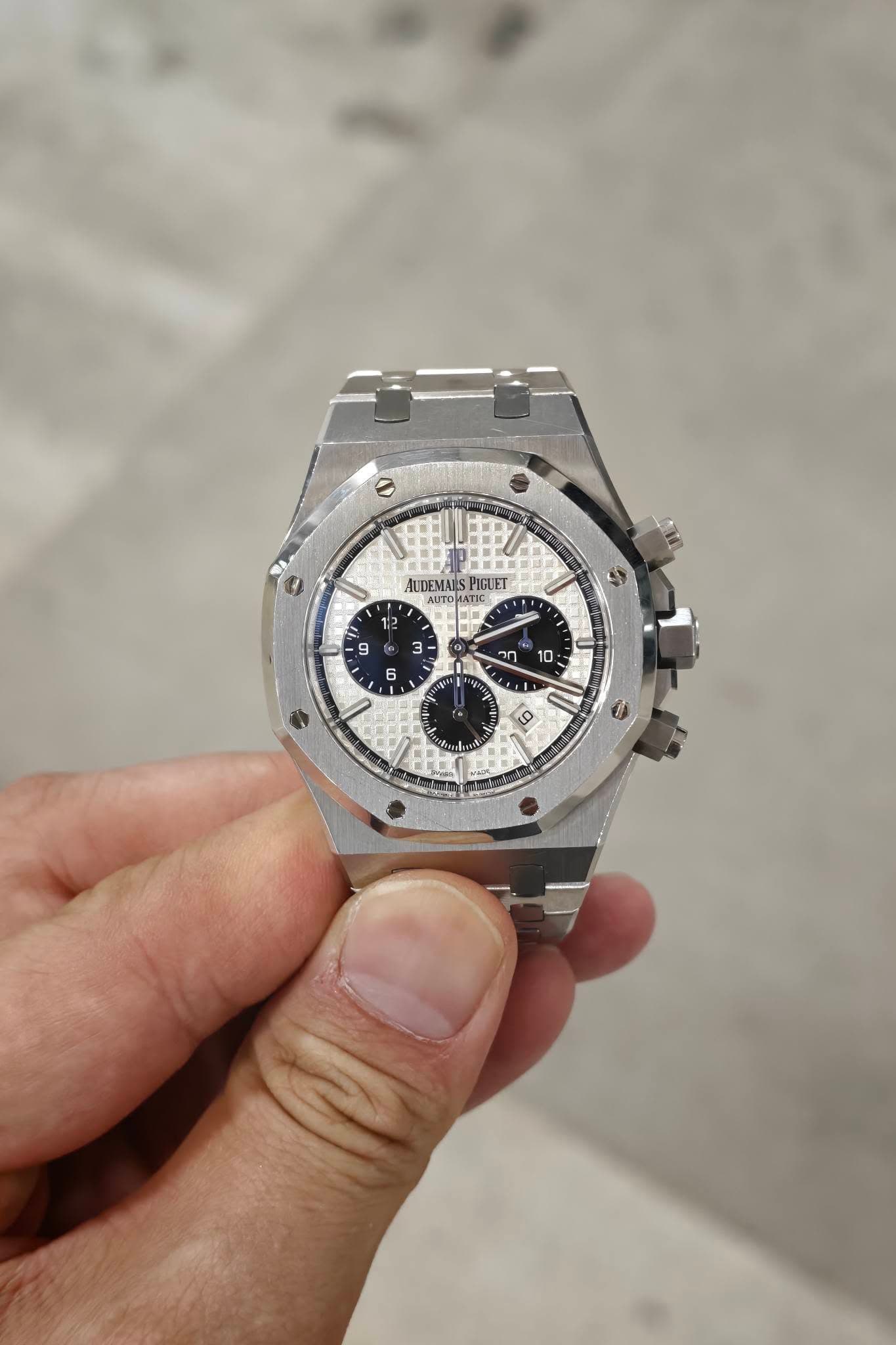 May be an image of wrist watch and text