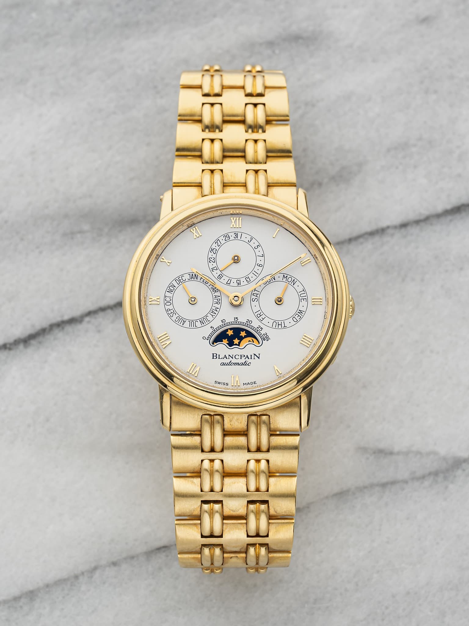 May be an image of jewelry, wrist watch and text