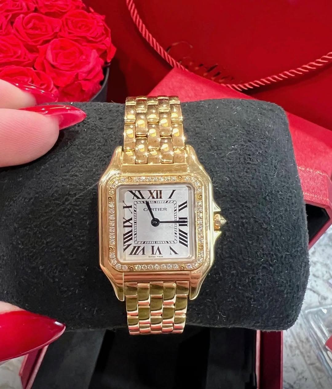 May be an image of wrist watch and text