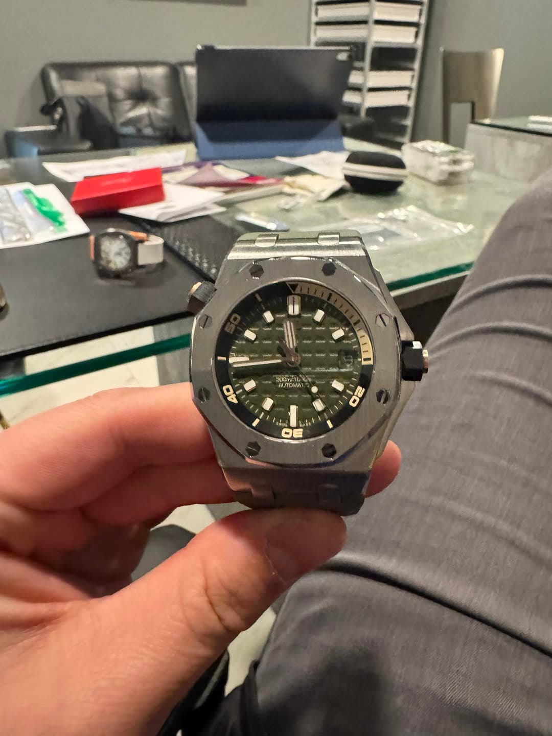 May be an image of wrist watch and text