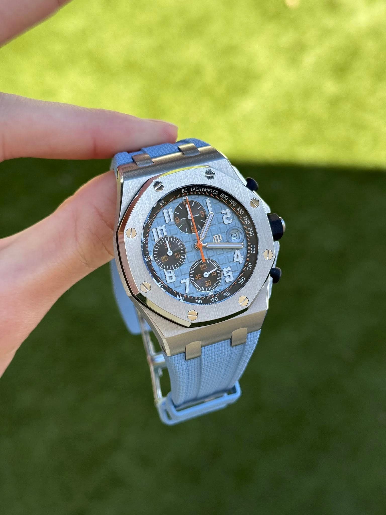May be an image of wrist watch and text