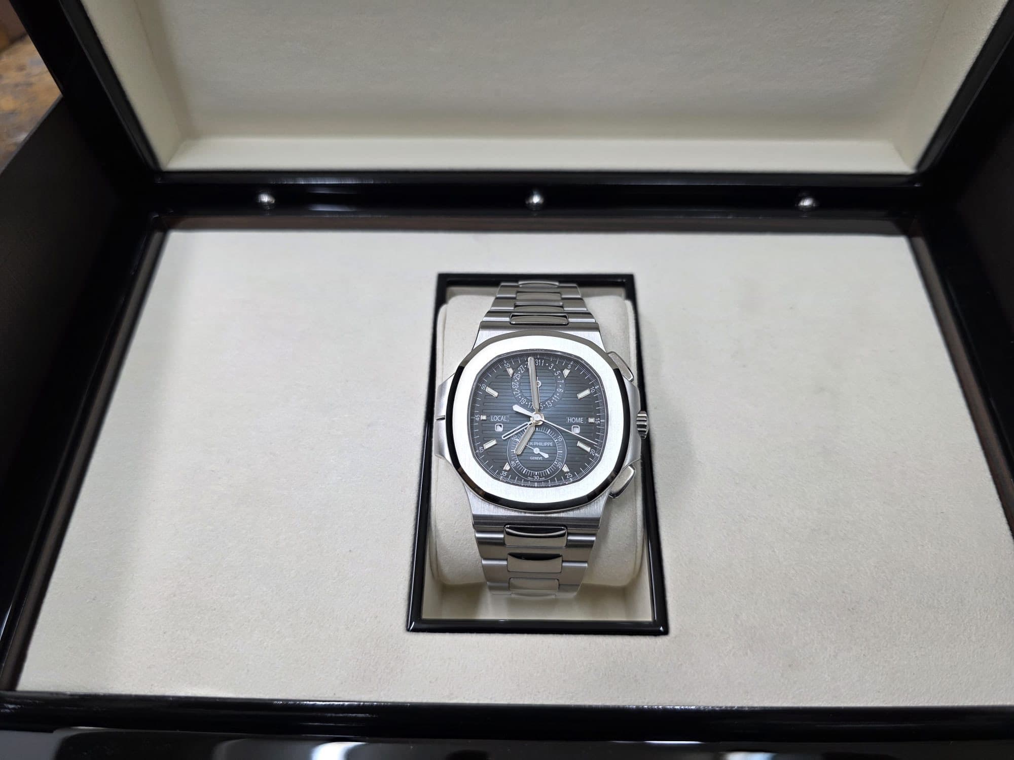 May be an image of wrist watch and text