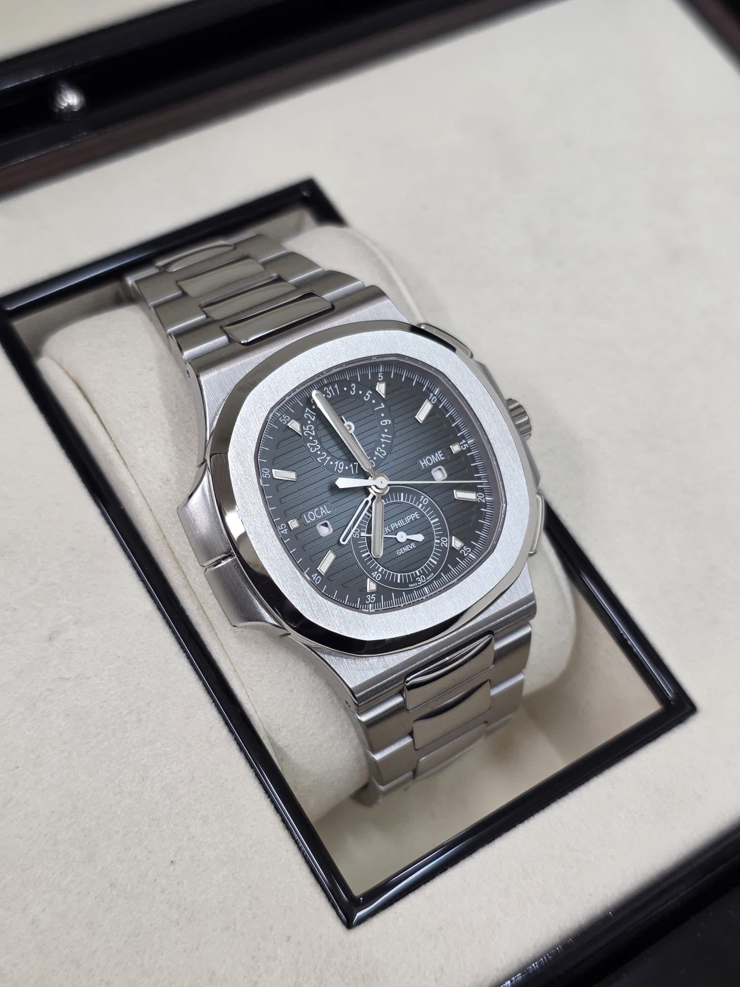 May be an image of wrist watch and text
