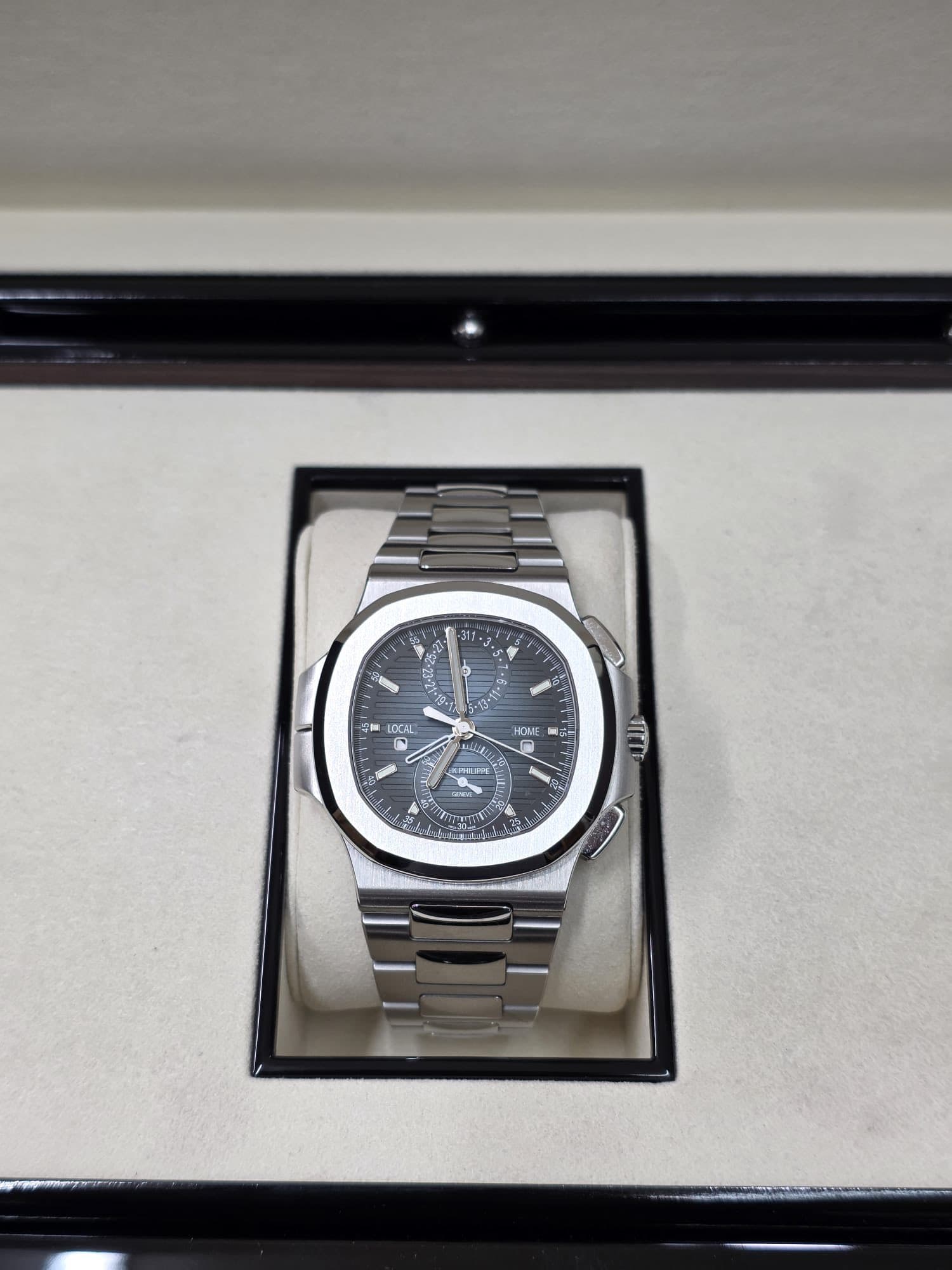 May be an image of wrist watch and text