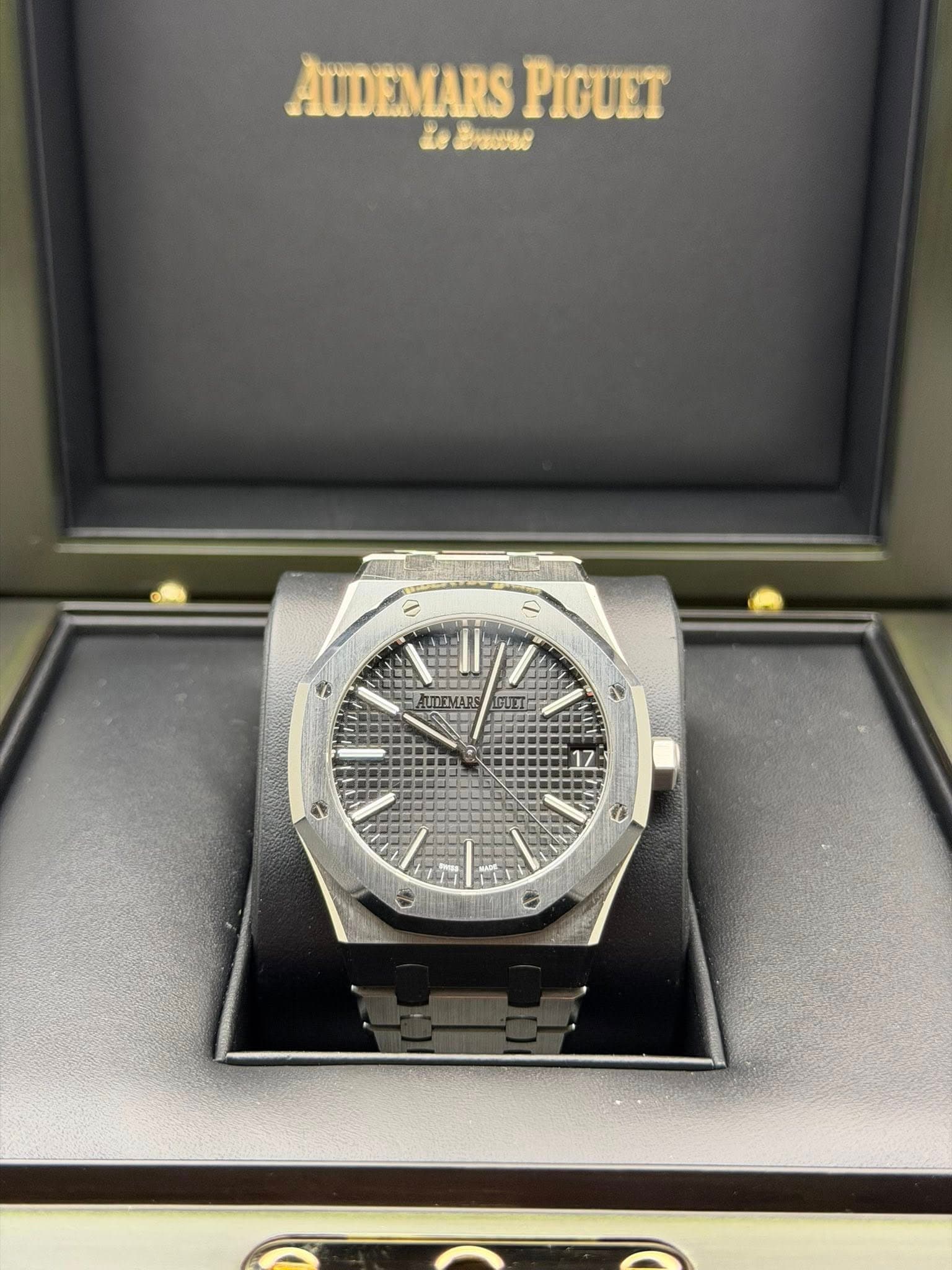 May be an image of wrist watch and text