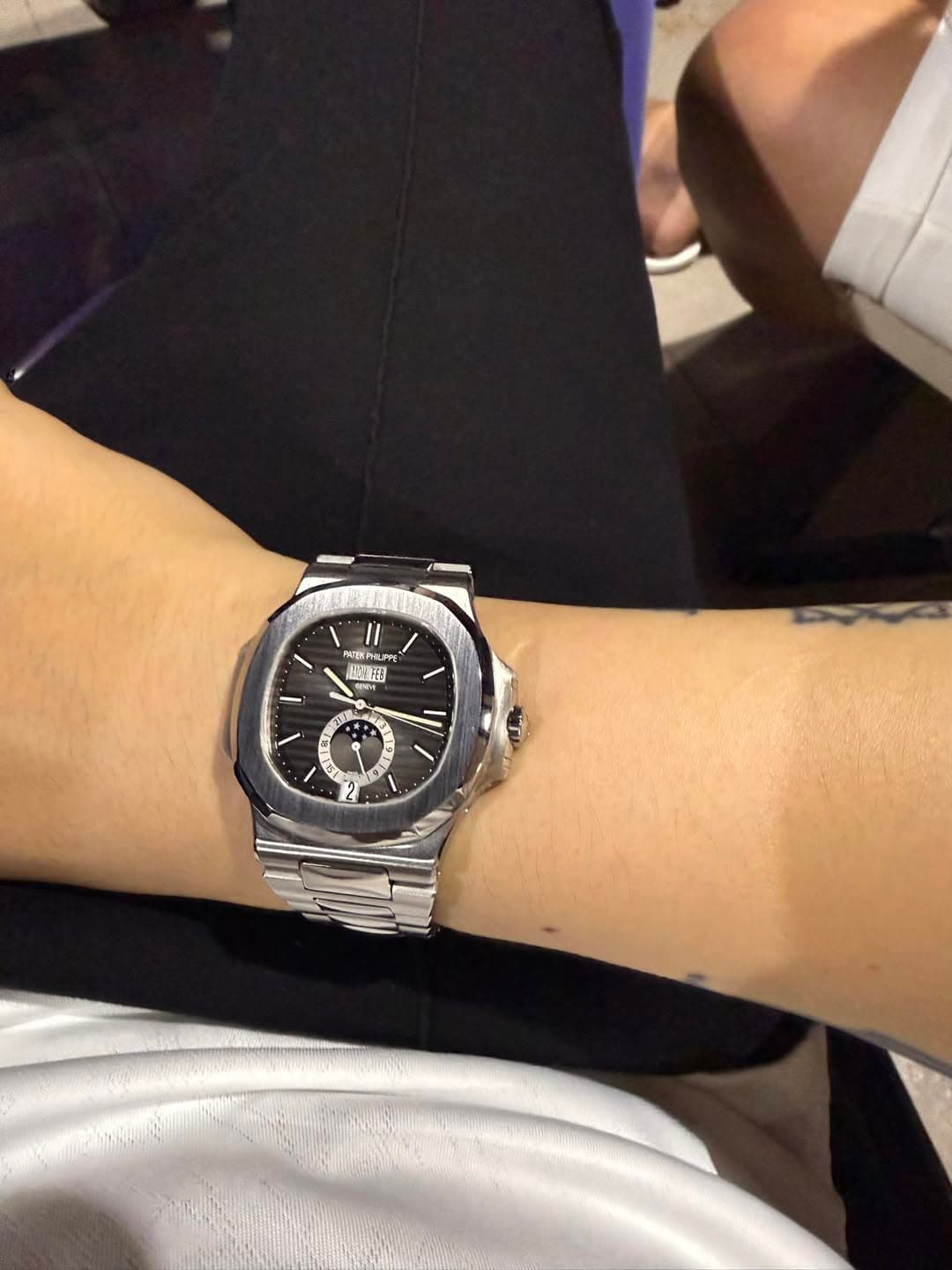 May be an image of wrist watch and text