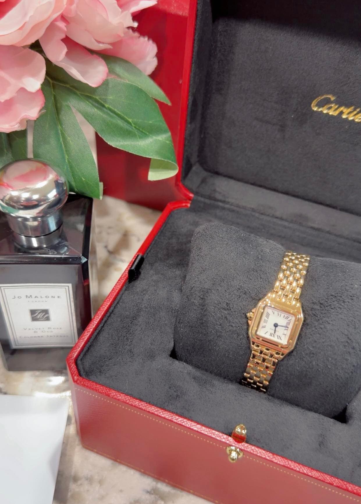 May be an image of wrist watch and text