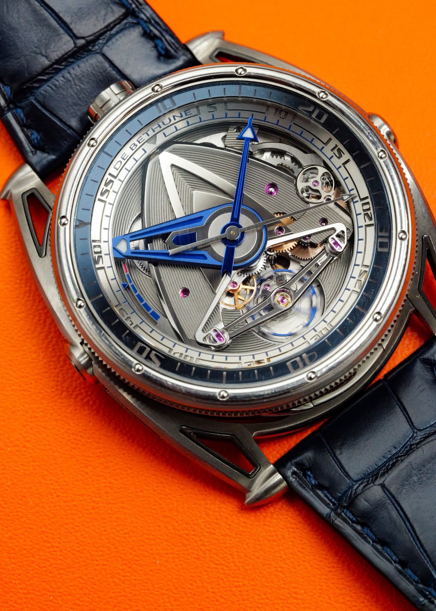 May be an image of wrist watch and text that says '® C ခ BETHUNE HUNE B D DE E KHA D G O Q'