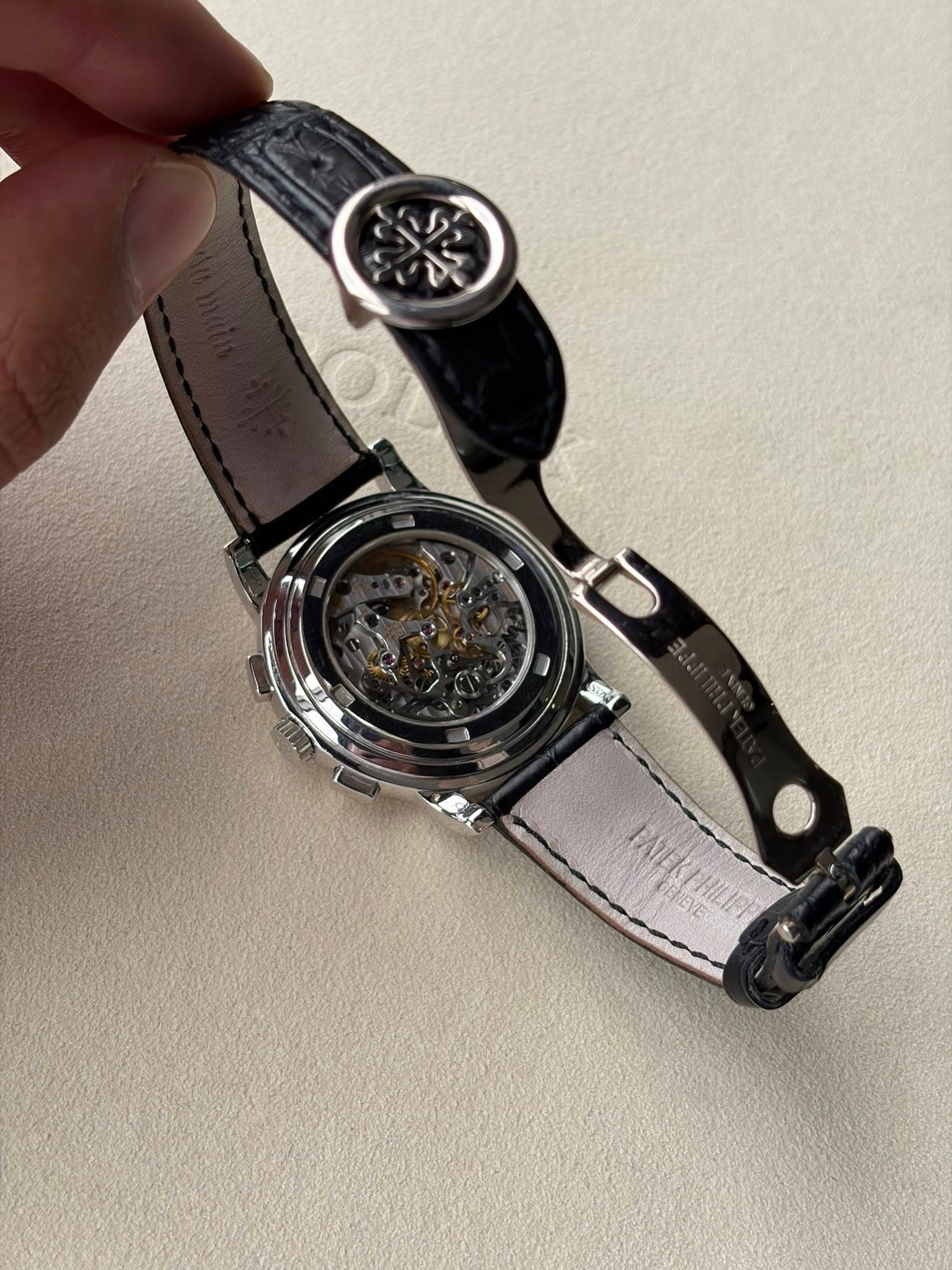 May be an image of wrist watch and text