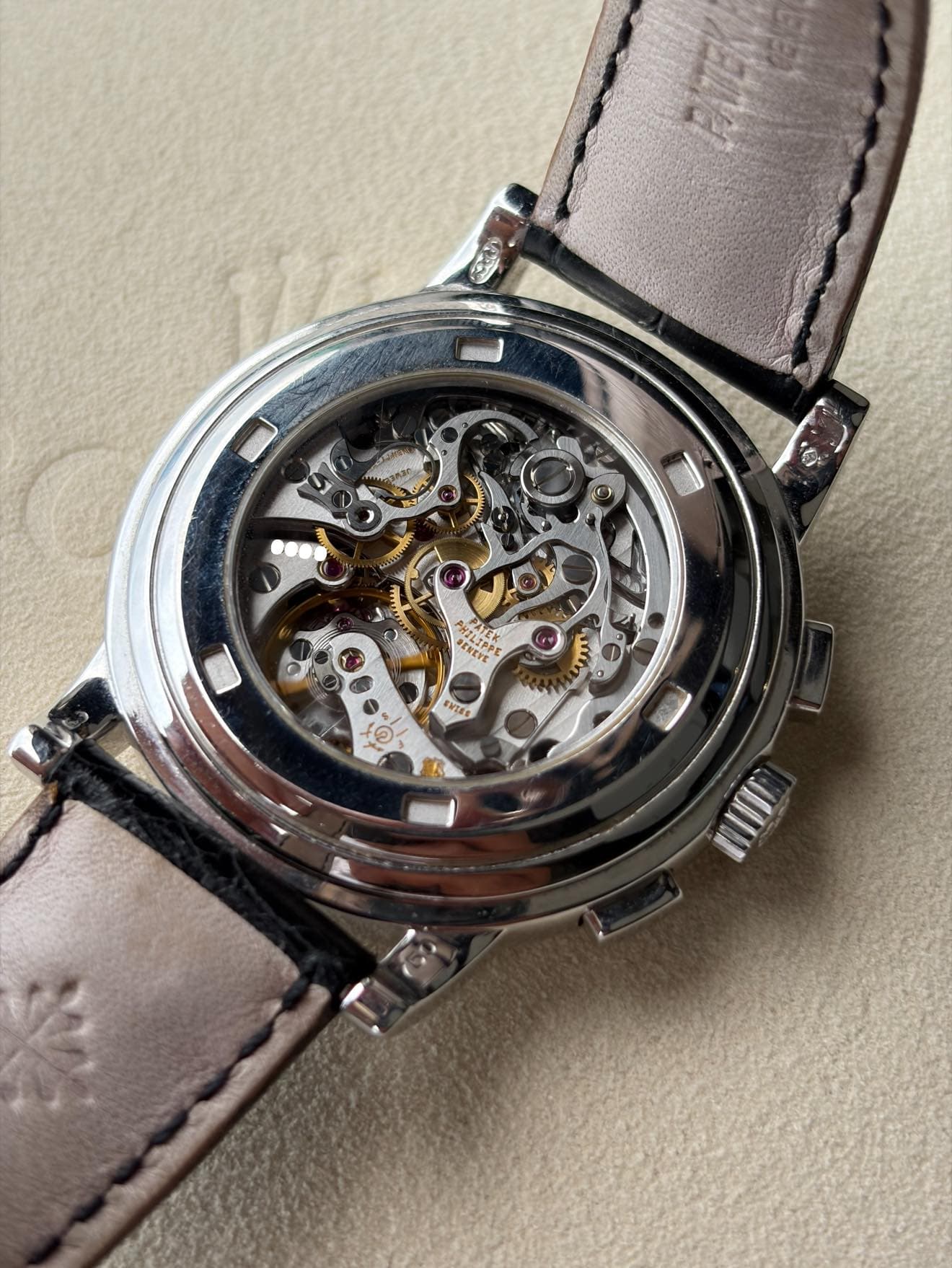 May be an image of wrist watch and text
