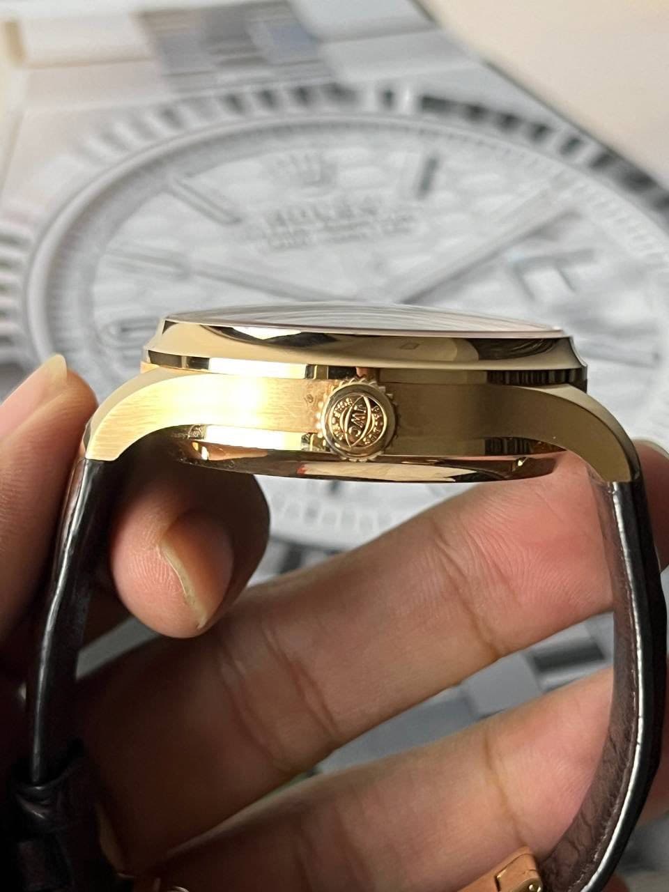 May be an image of wrist watch and text that says 'ትር an'