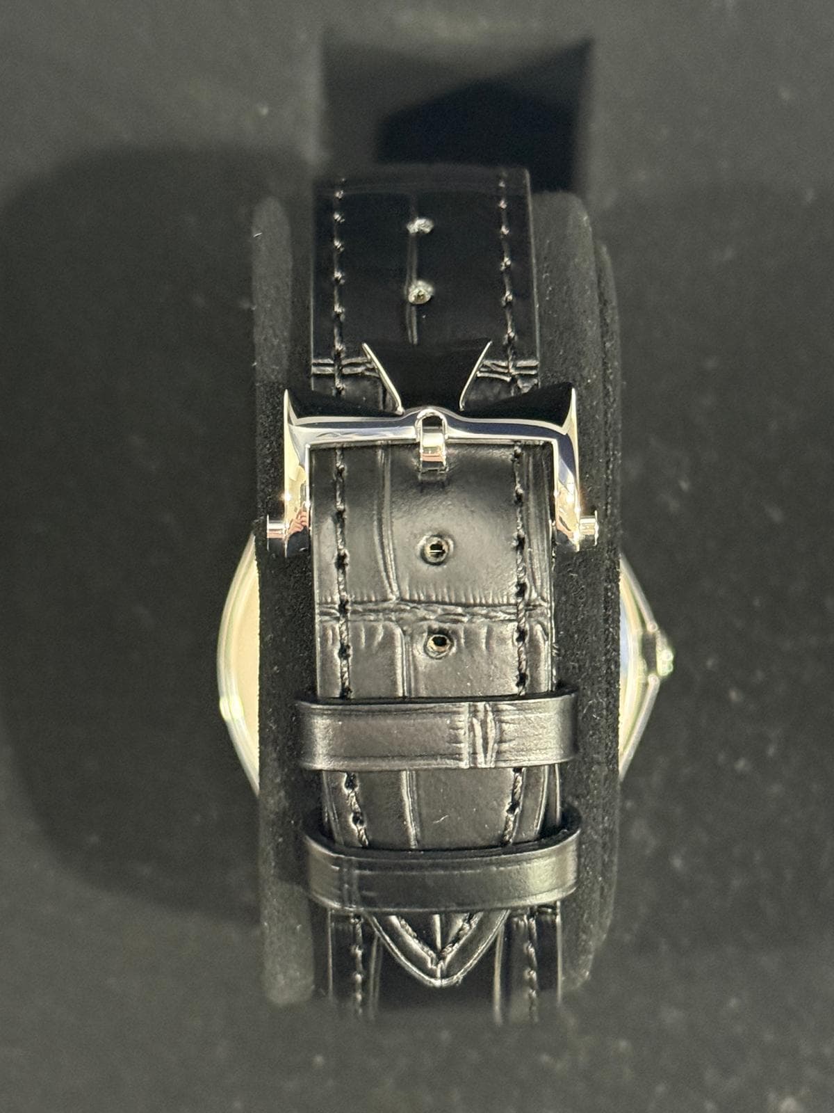 May be an image of wrist watch and leather