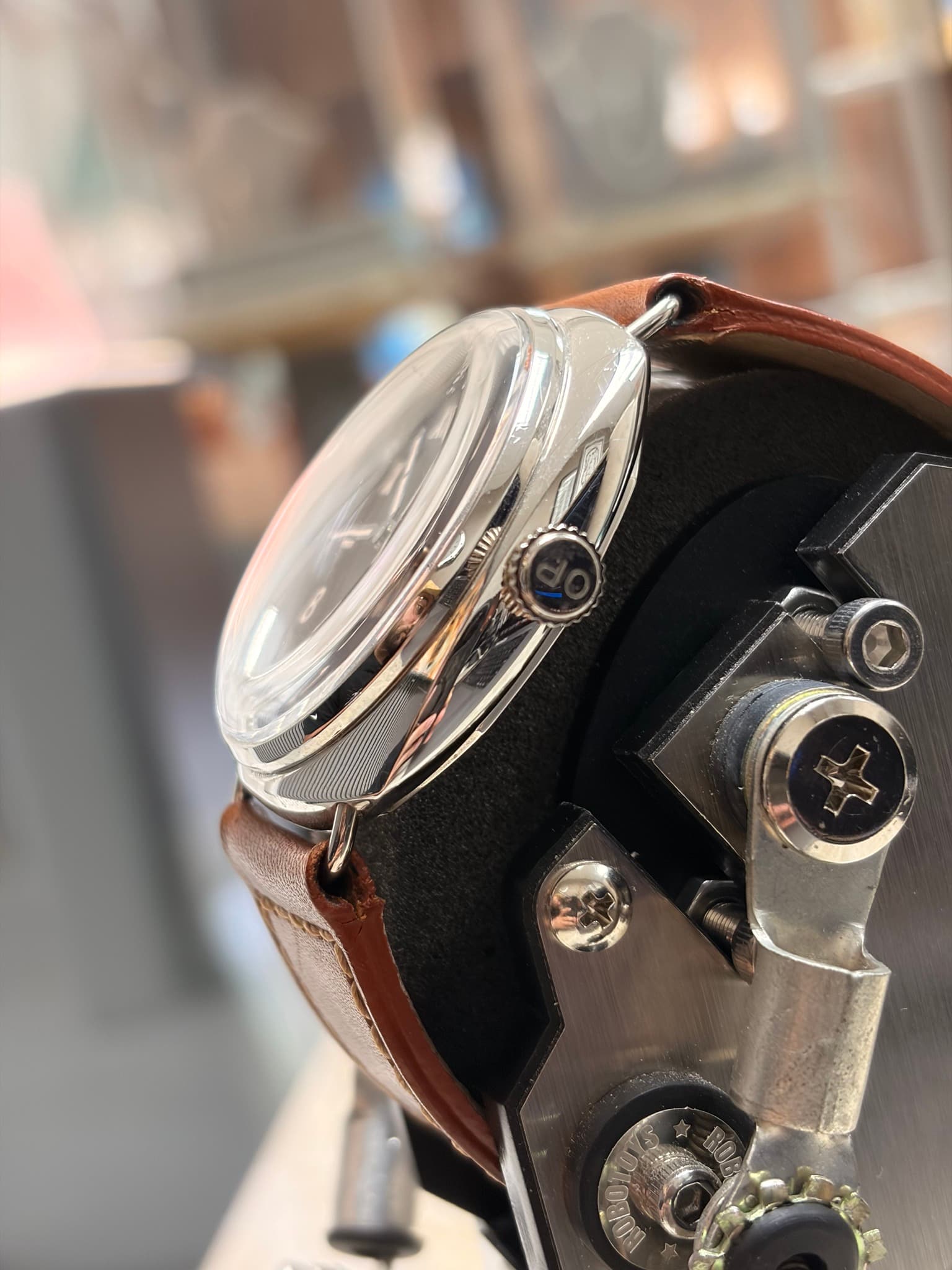 May be an image of wrist watch and text