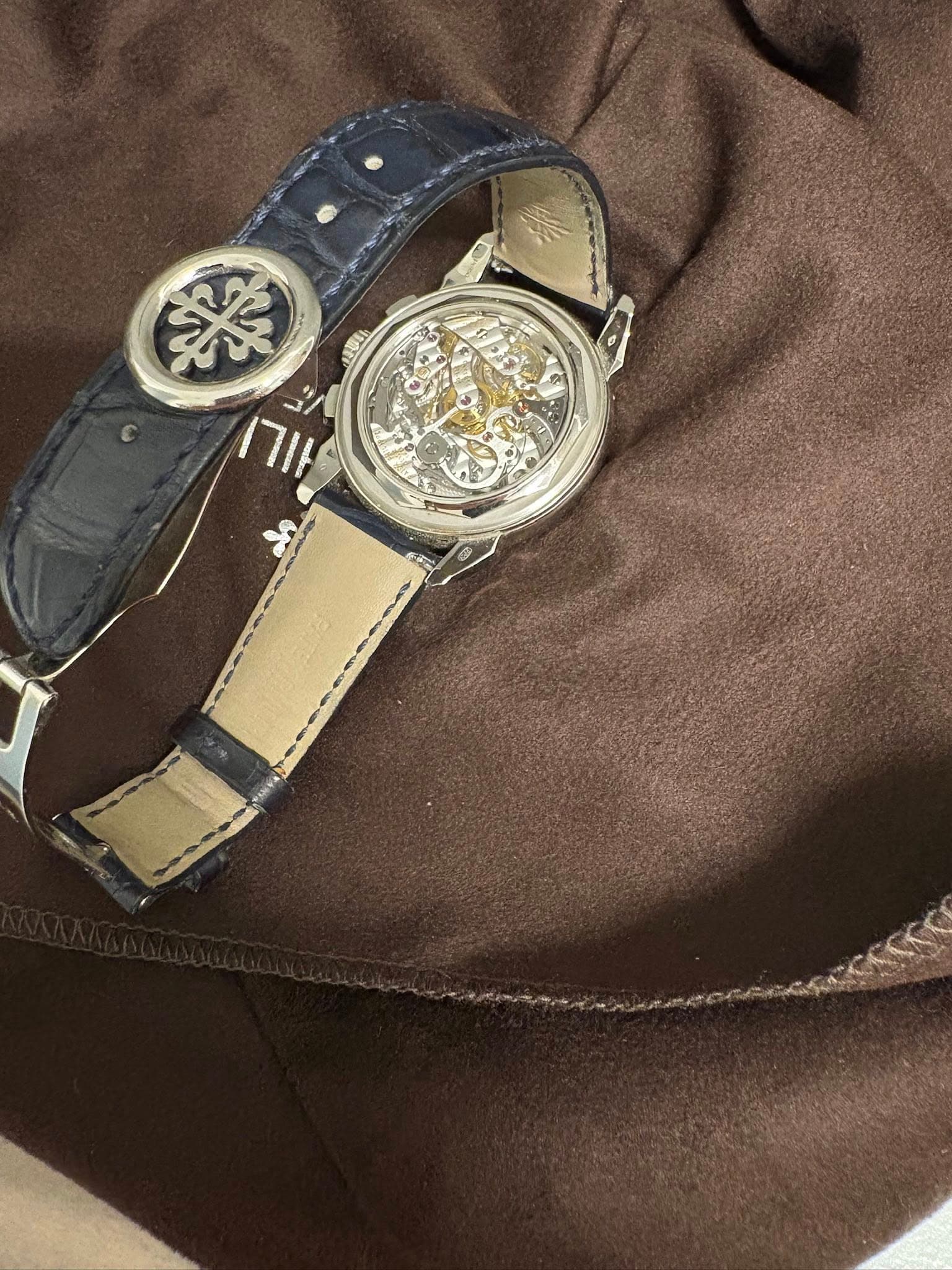 May be an image of wrist watch and leather