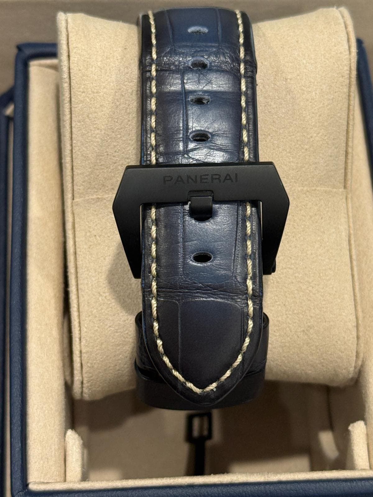 May be an image of saddle-stitched leather, wrist watch and text