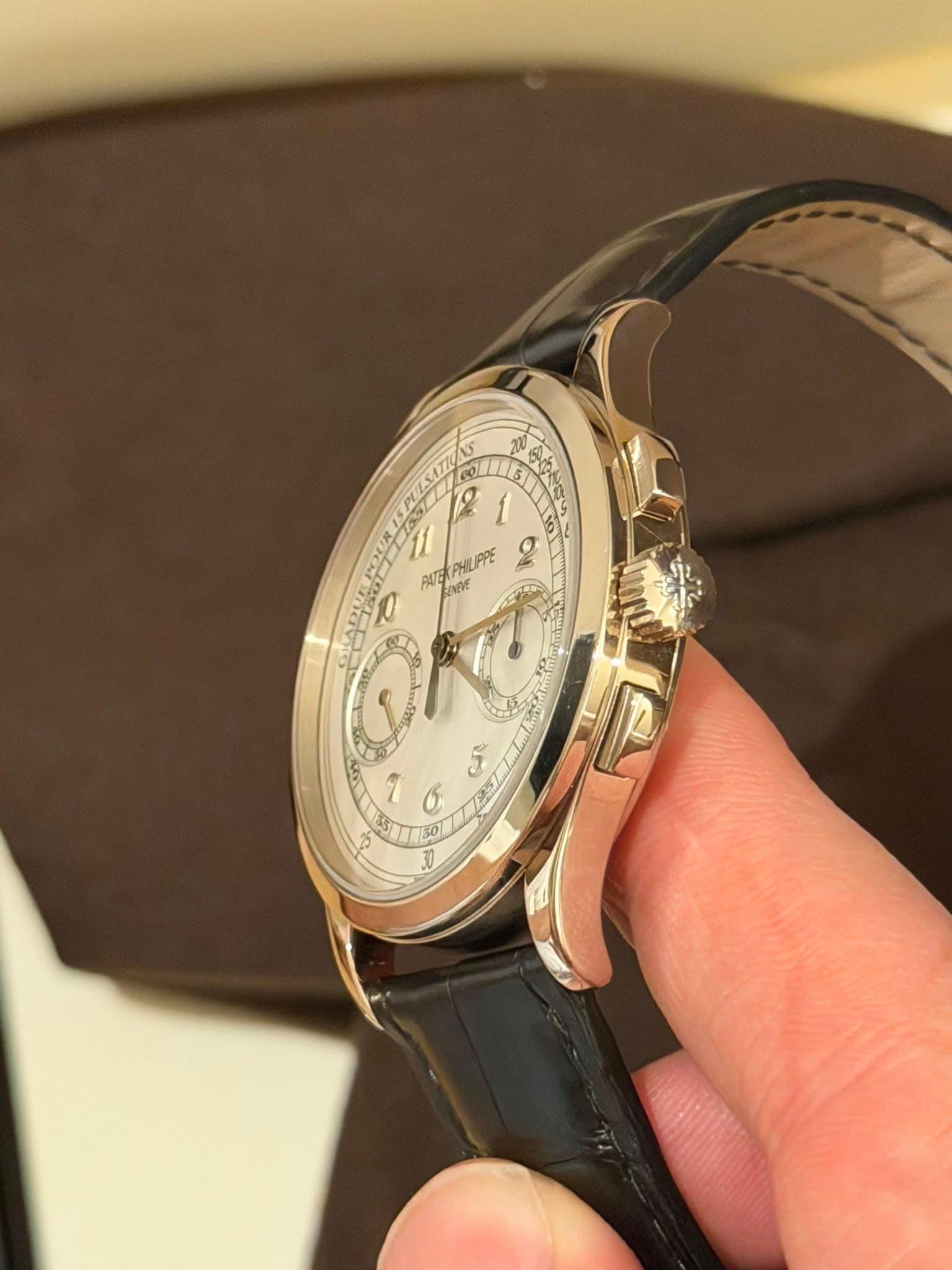 May be an image of wrist watch and text