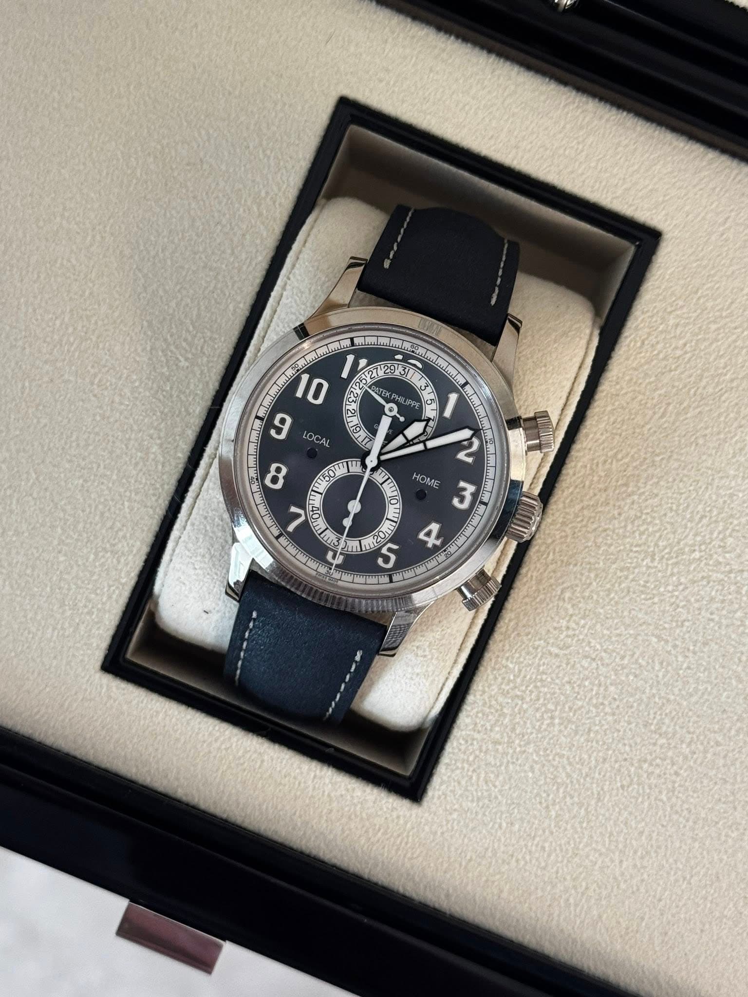 May be an image of wrist watch and text