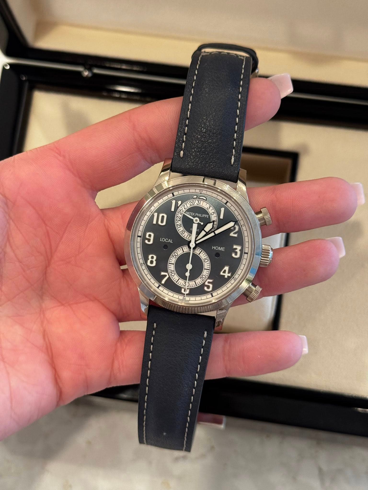May be an image of wrist watch and text