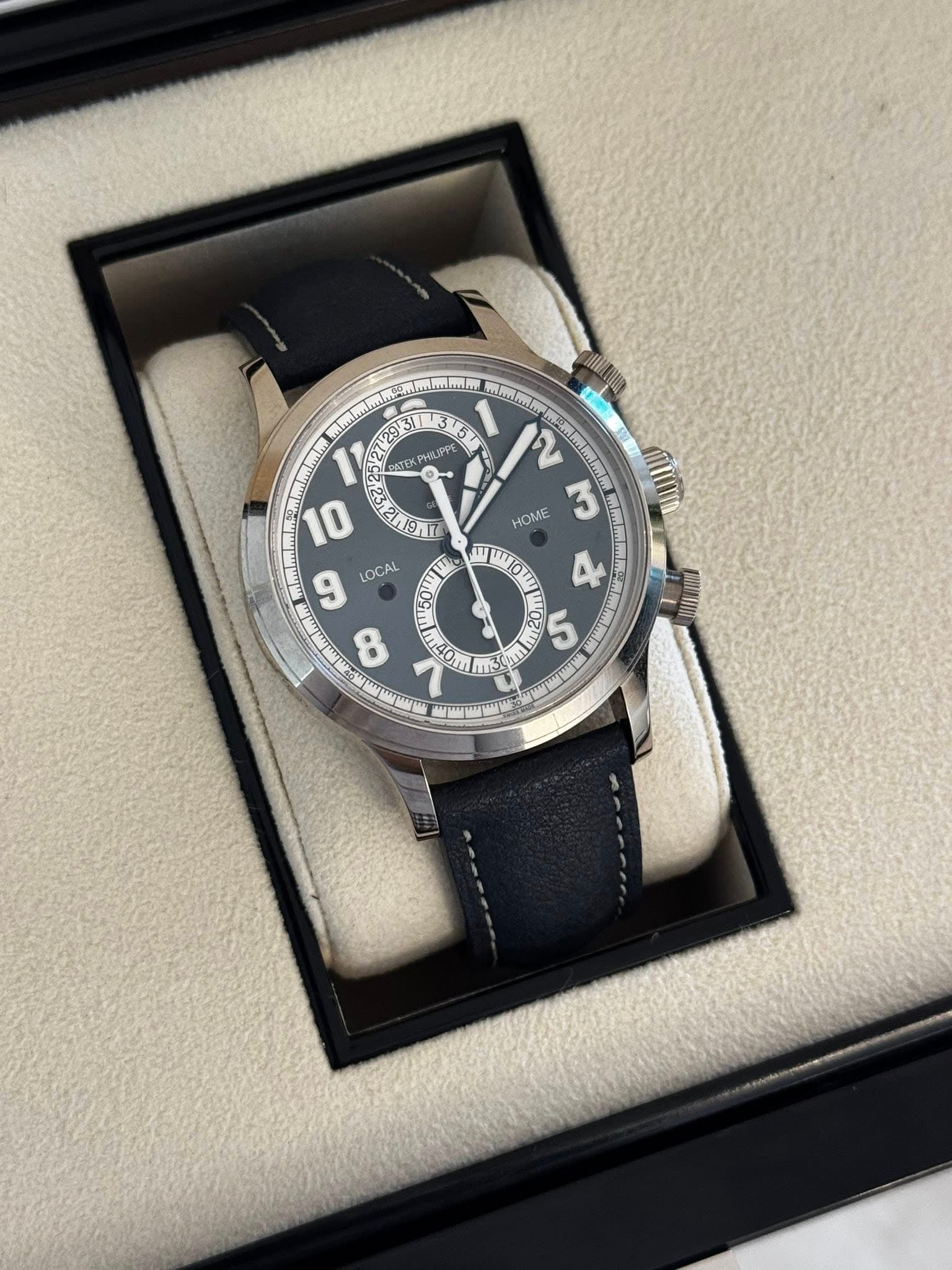May be an image of wrist watch and text