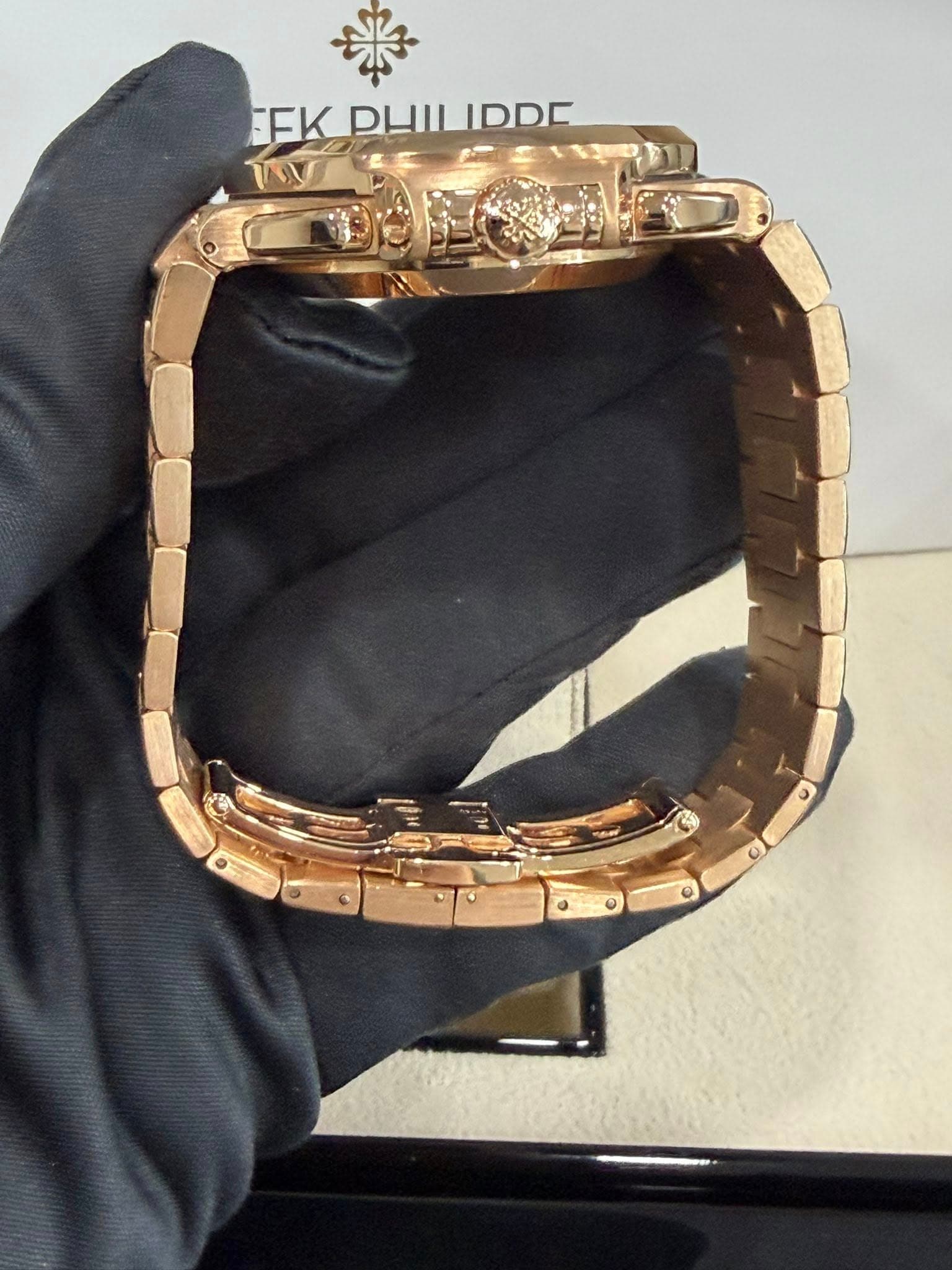 May be an image of wrist watch, jewelry and text