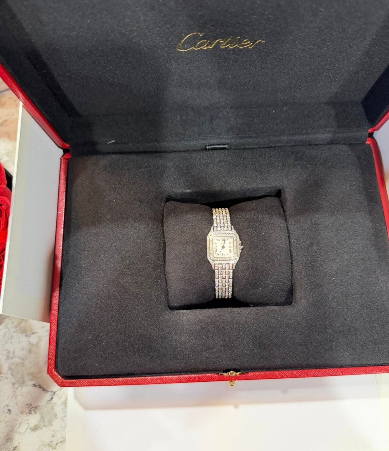 May be an image of jewelry, wrist watch and text