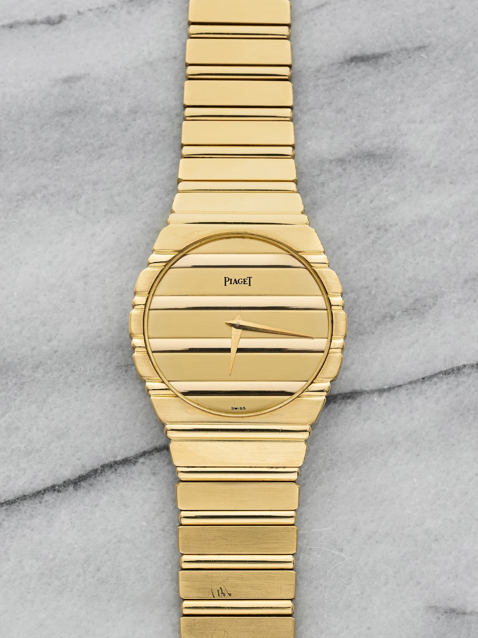 May be an image of wrist watch and text that says 'PIAGET SWISS'