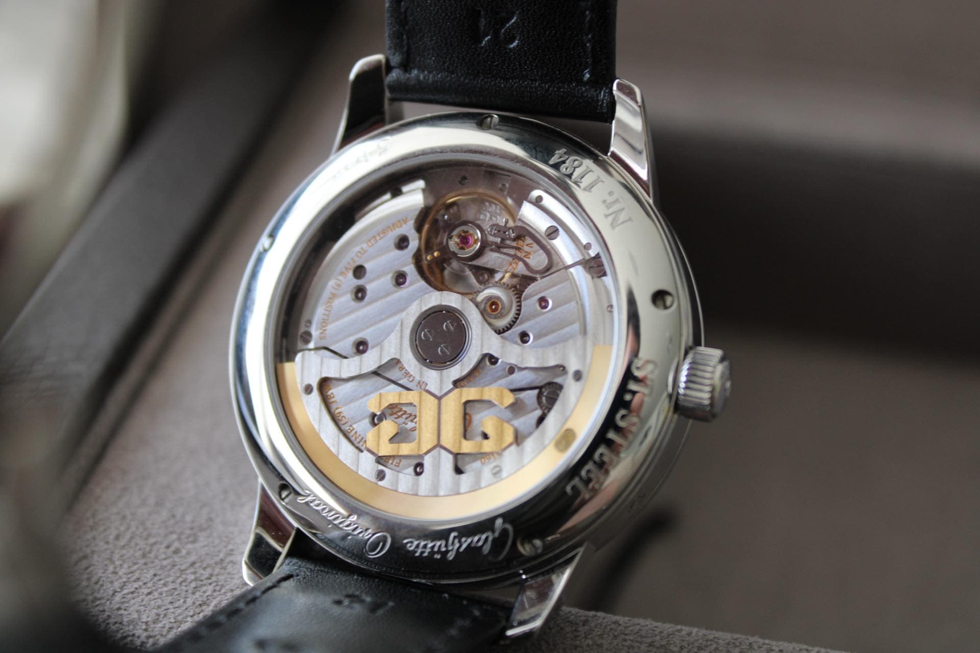 May be an image of wrist watch and text
