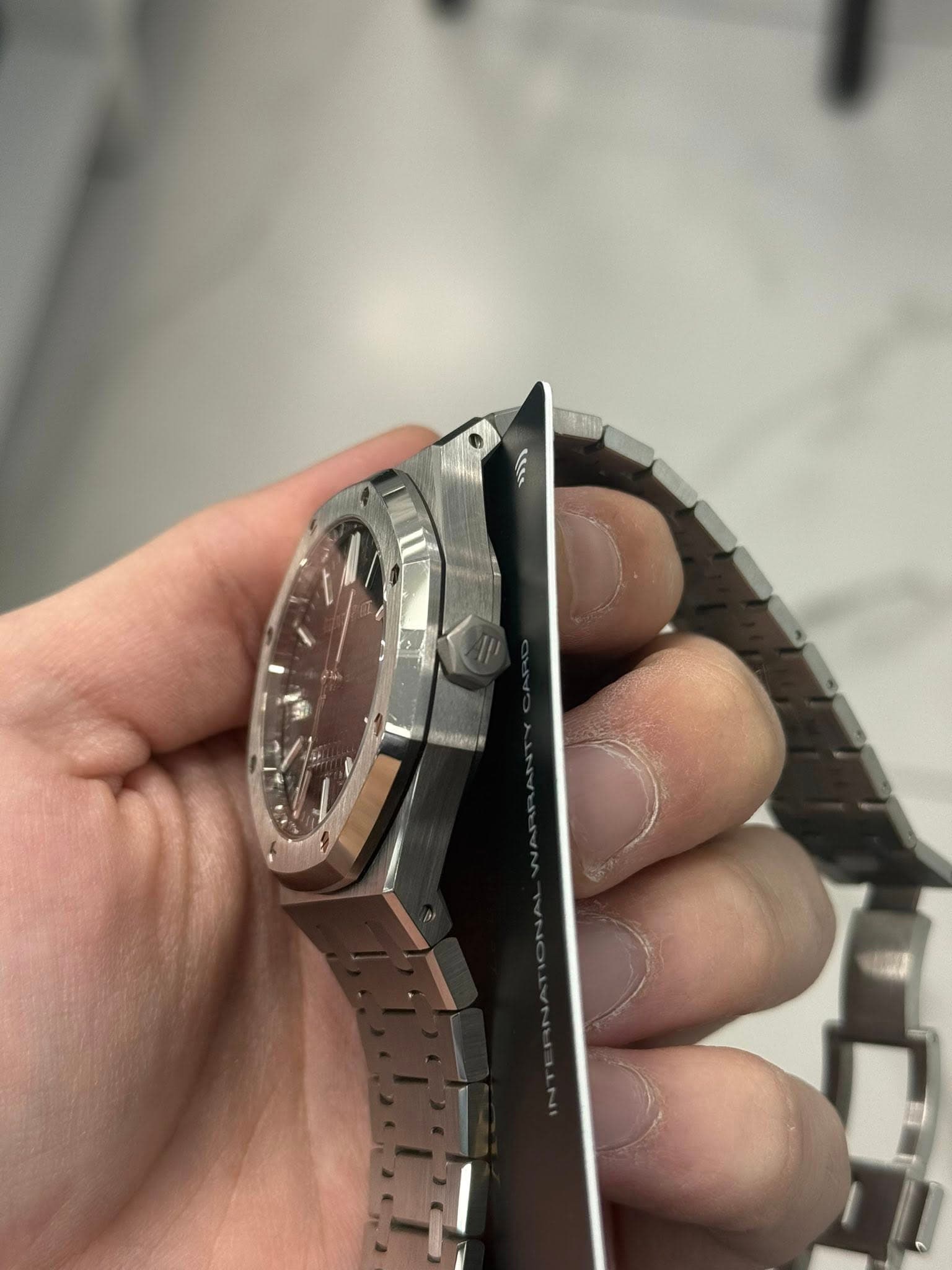 May be an image of wrist watch and text