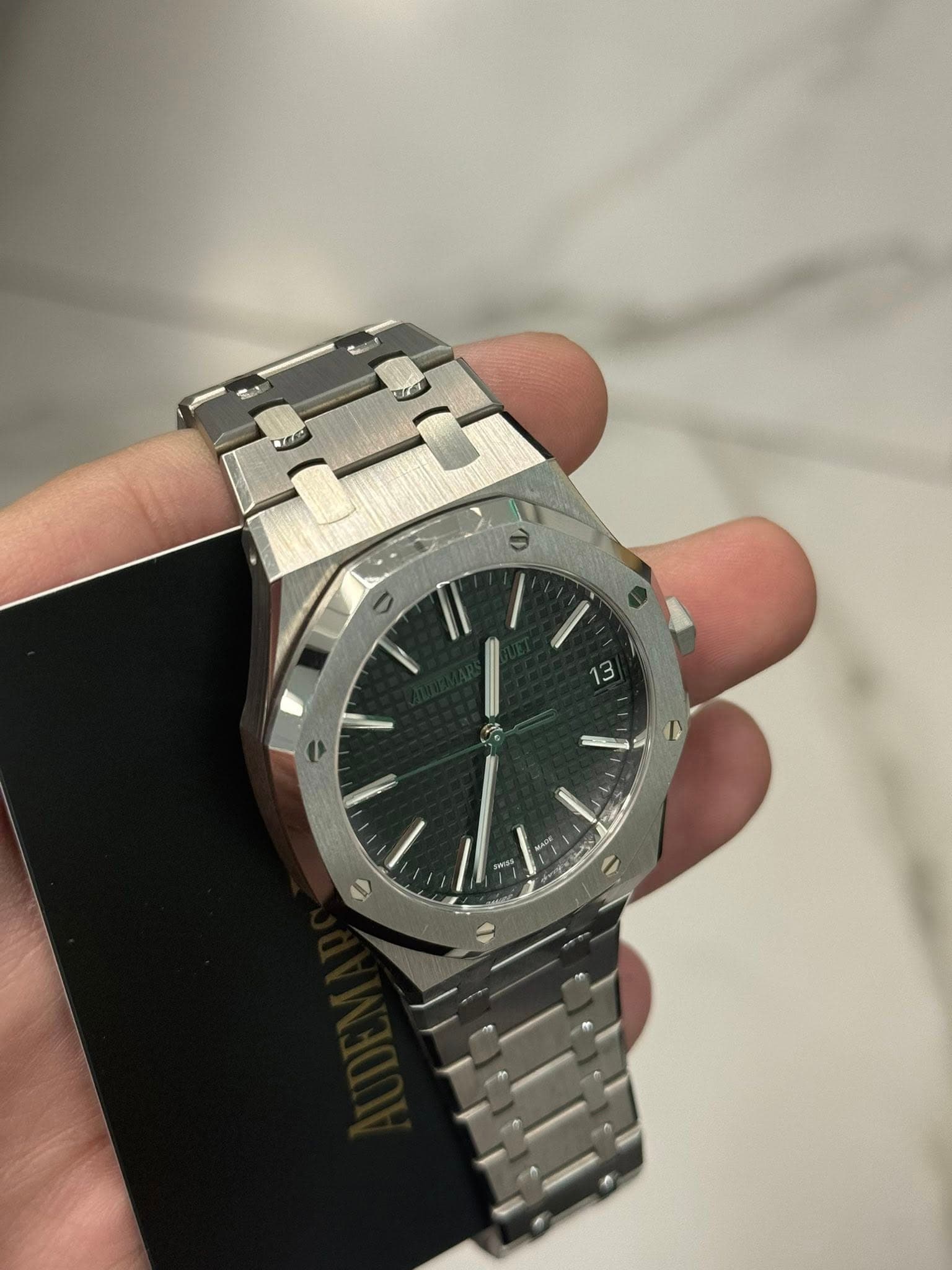 May be an image of wrist watch and text