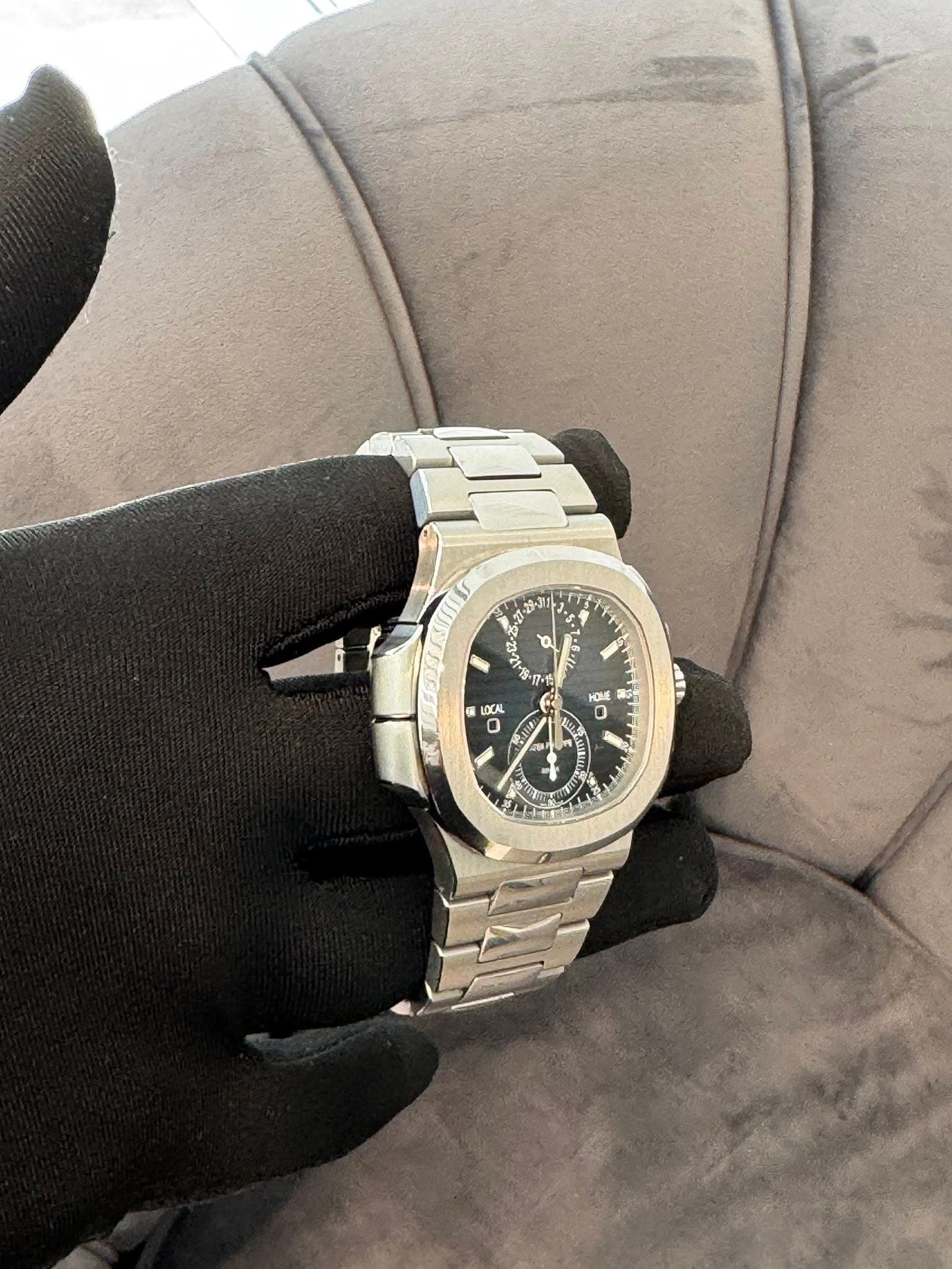 May be an image of wrist watch and text