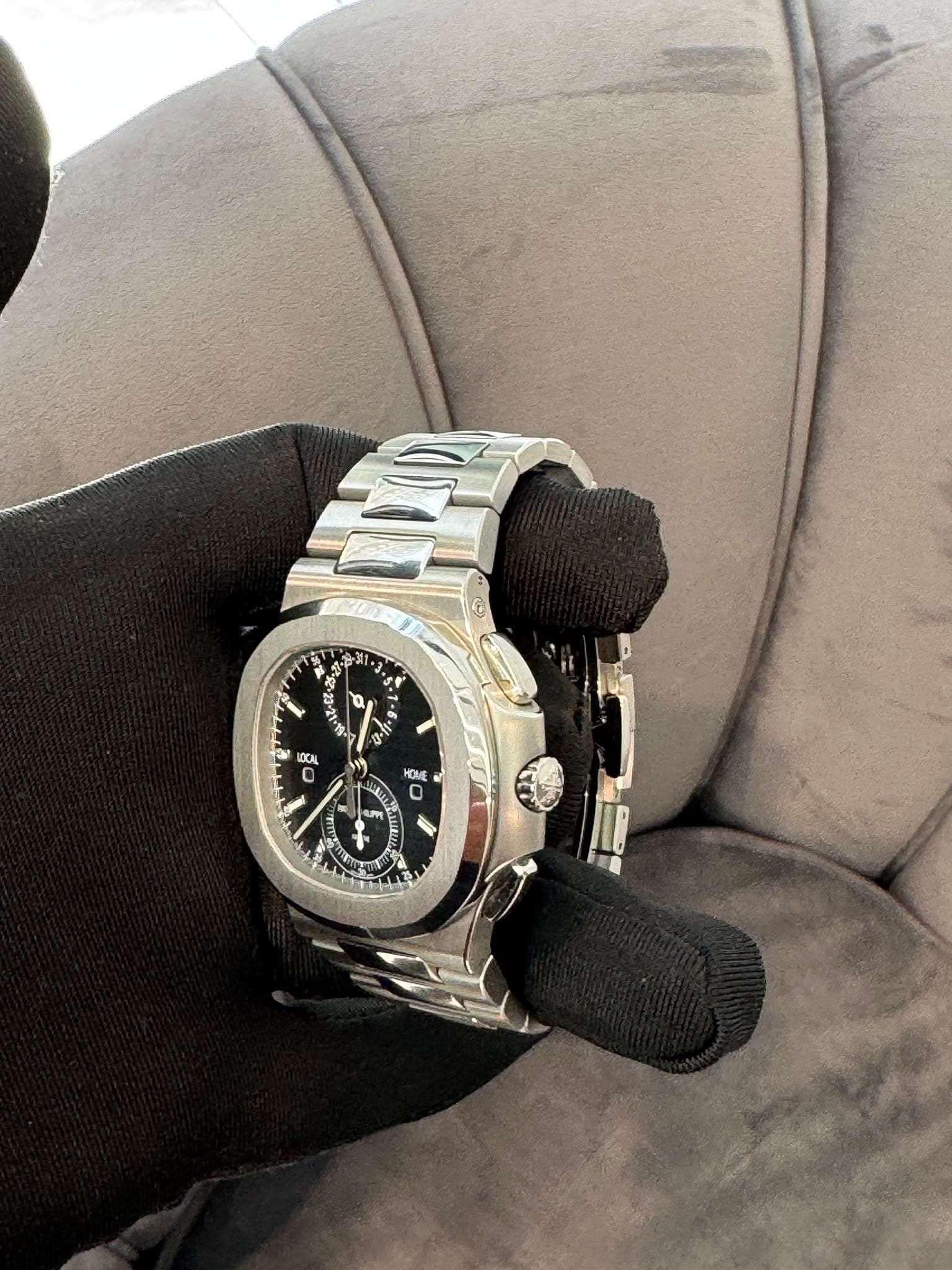 May be an image of wrist watch and text that says 'L 3 $ - 1 Q u 6 S AOCAL 0 OME ደንን S m F JL LIn 2'