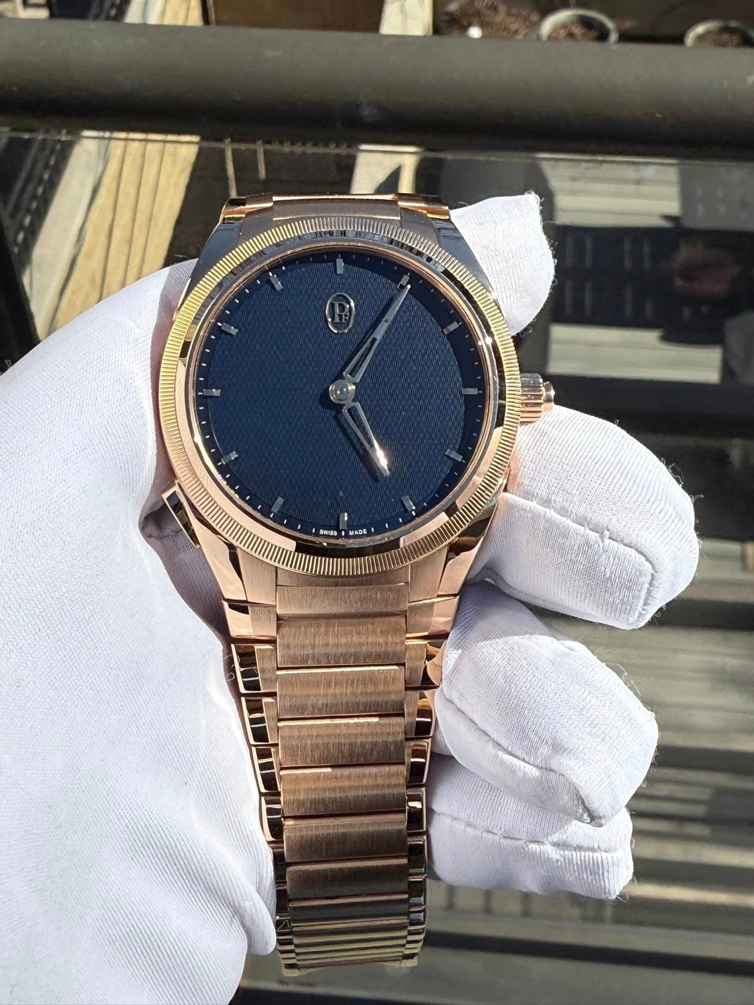 May be an image of wrist watch and text
