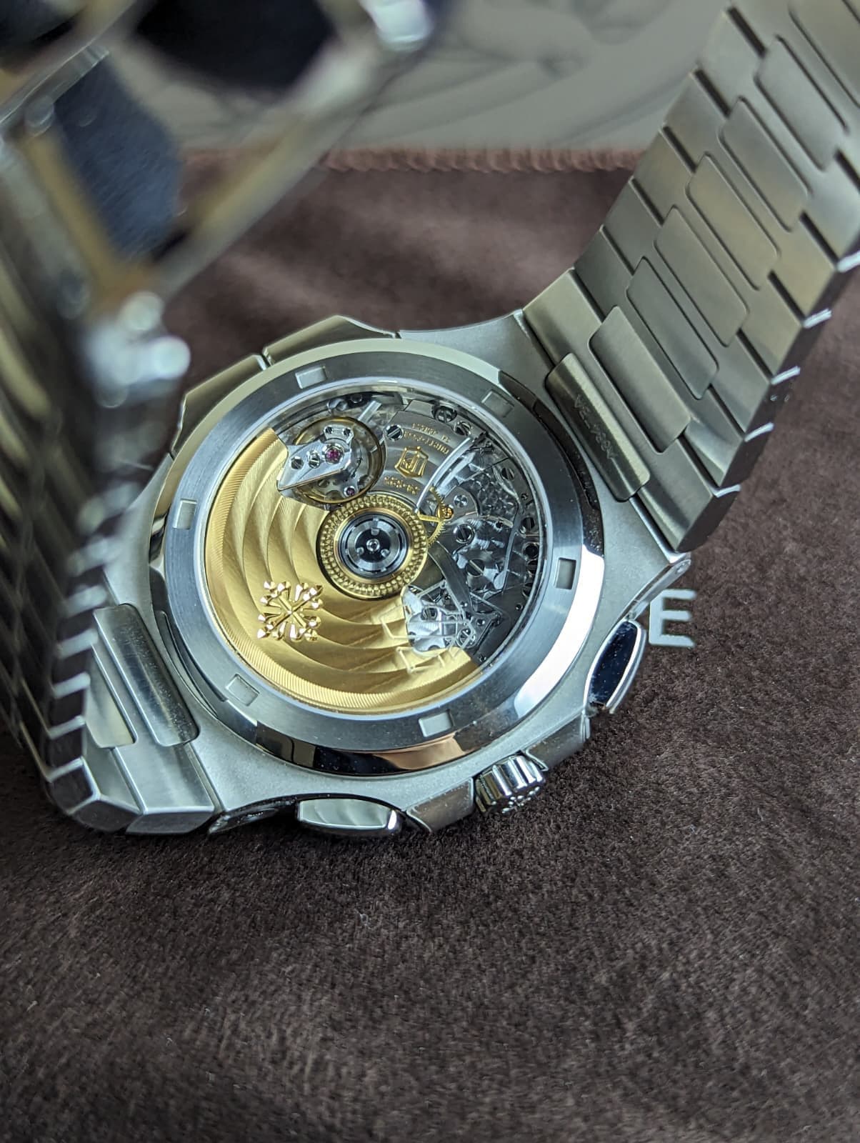 May be an image of wrist watch and text