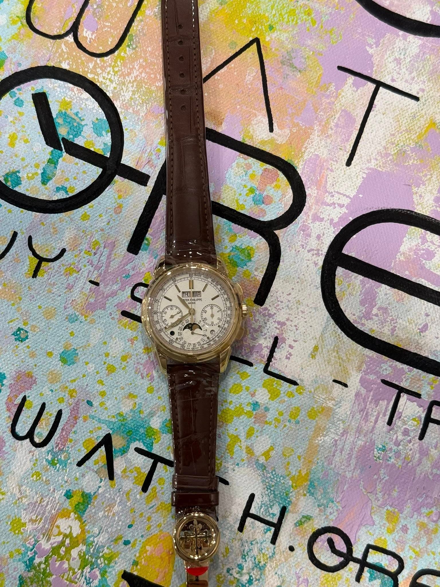 May be an image of wrist watch and text