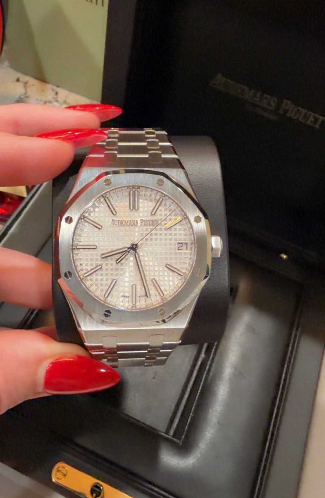 May be an image of wrist watch and text