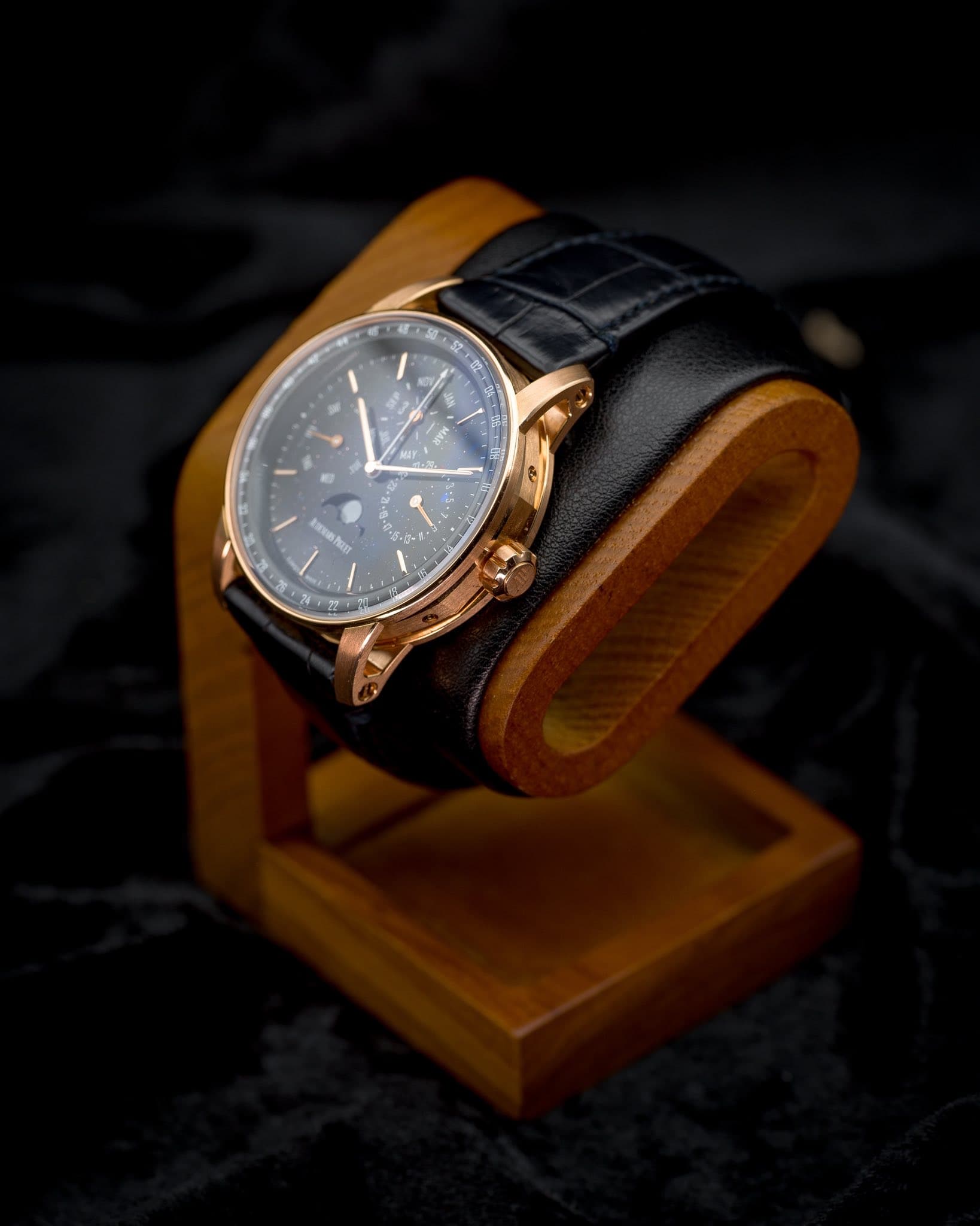 May be an image of wrist watch, leather and text