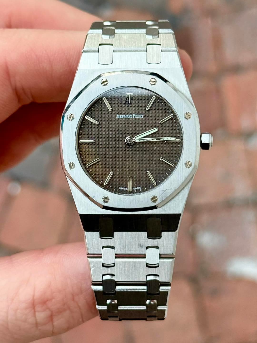 May be an image of wrist watch and text