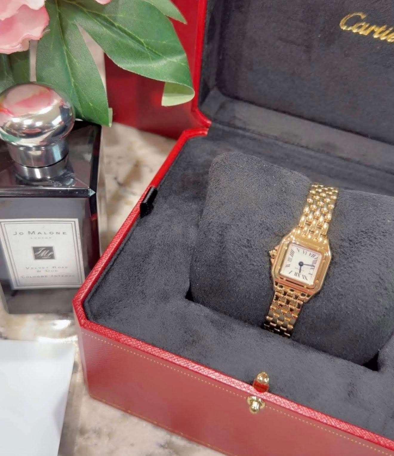 May be an image of wrist watch and text