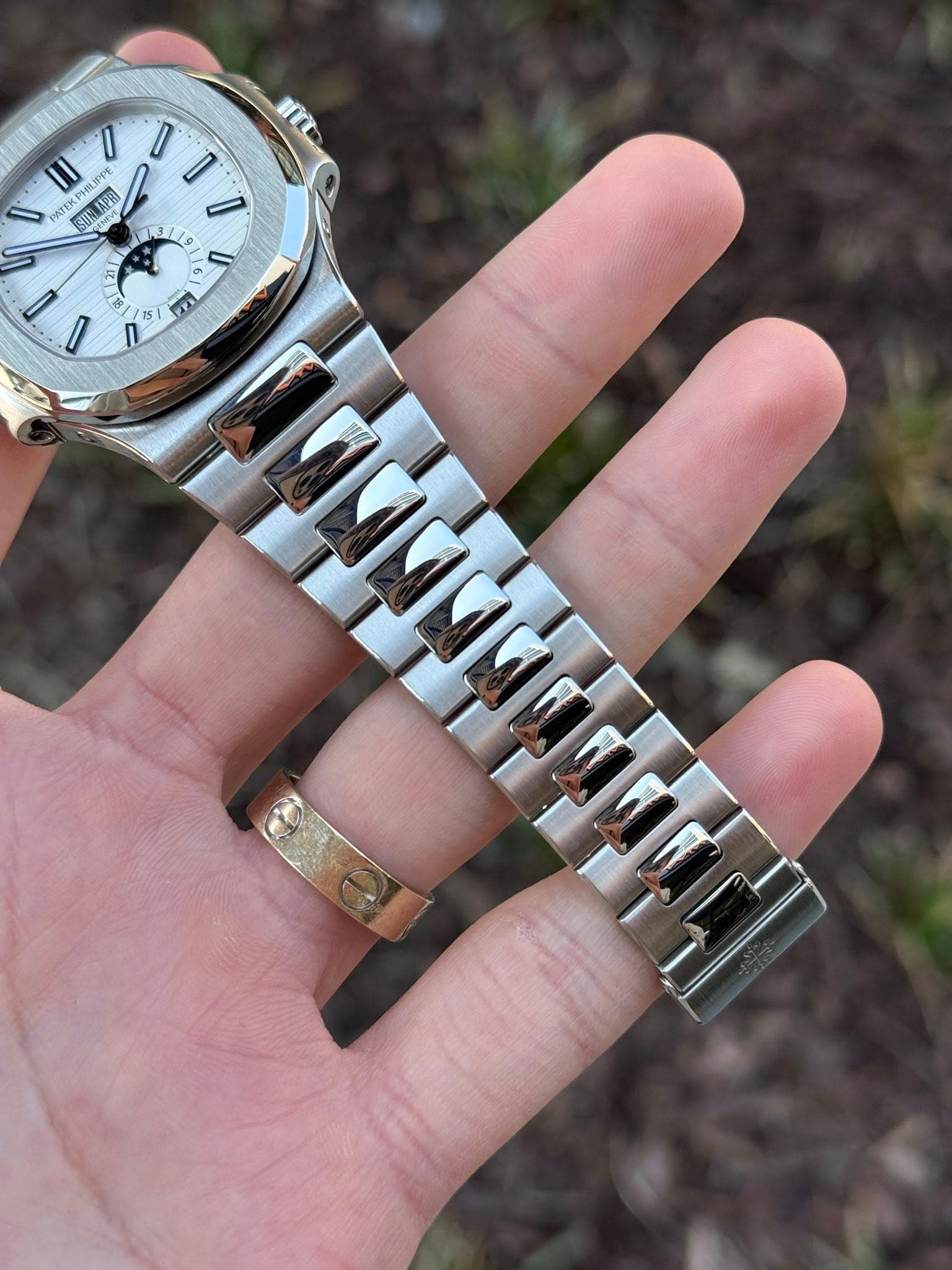 May be an image of wrist watch and text