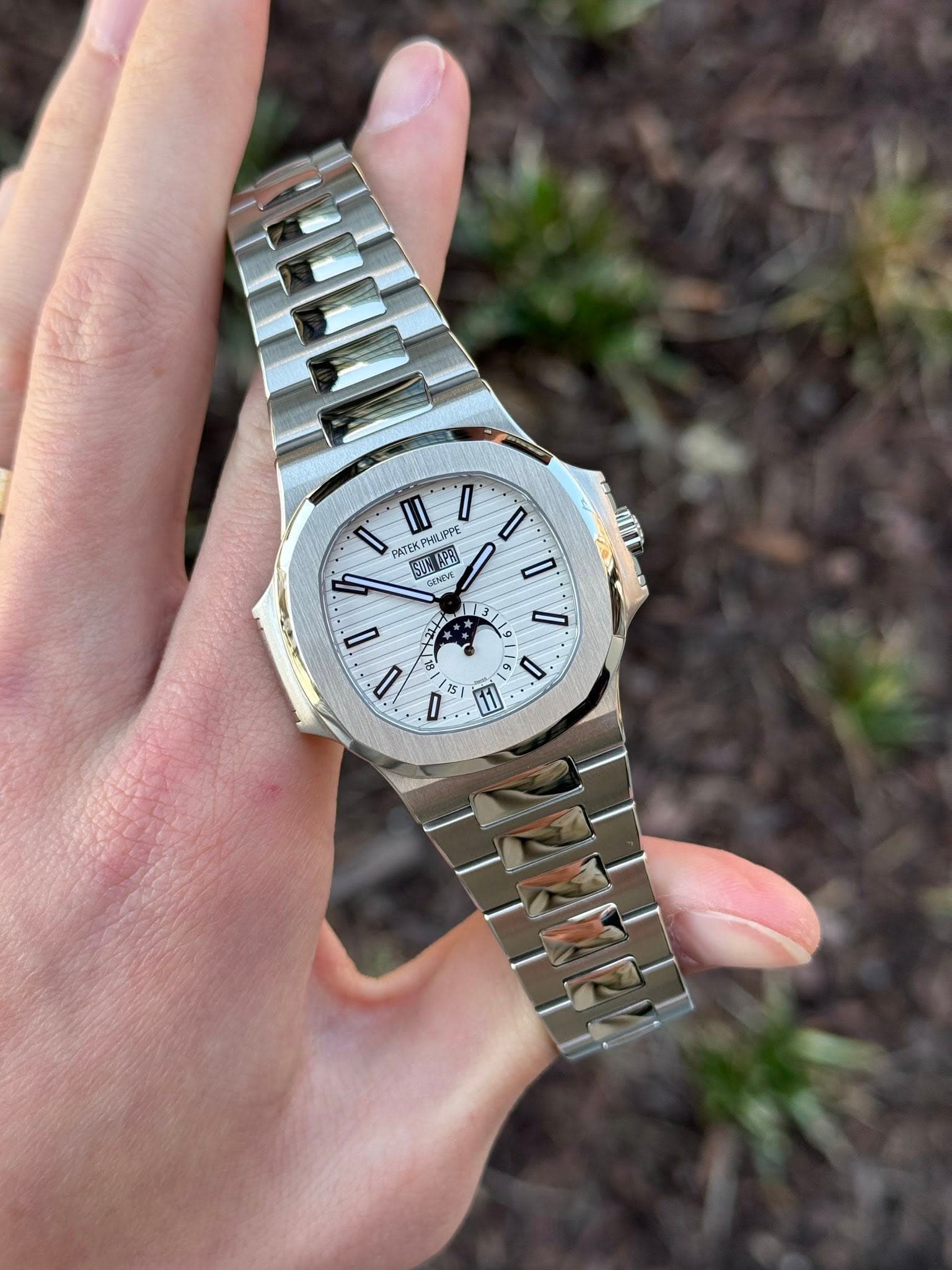 May be an image of wrist watch and text