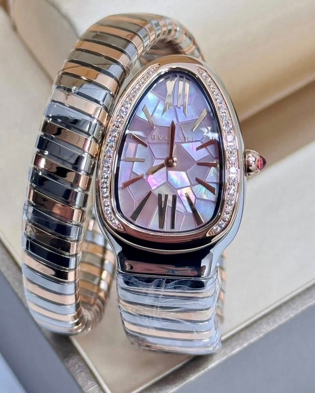 May be an image of wrist watch and jewelry