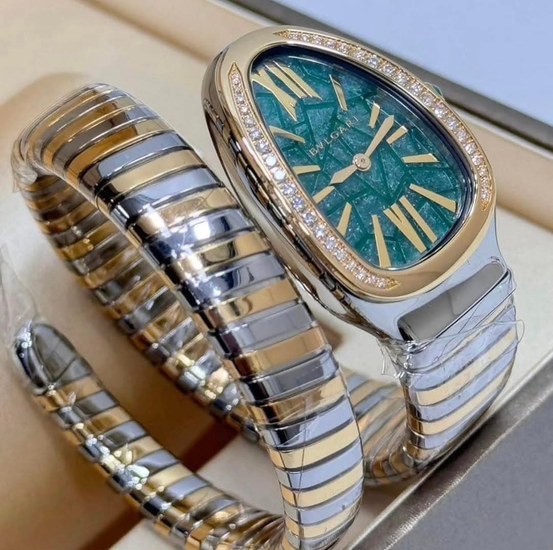 May be an image of jewelry, wrist watch and text