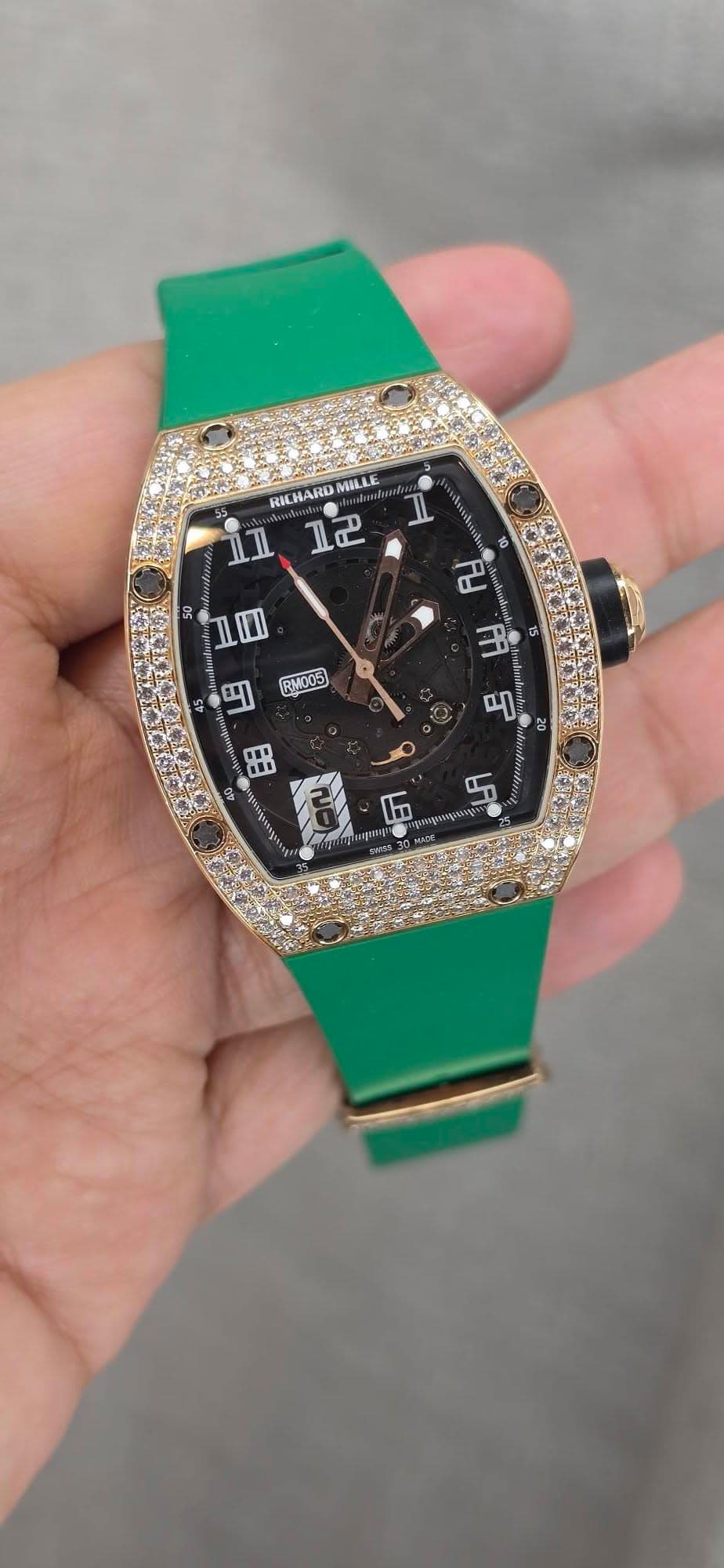 May be an image of wrist watch and text