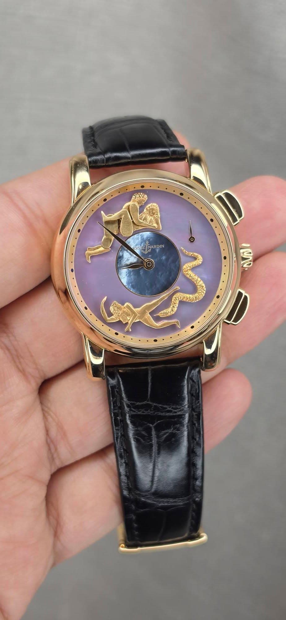 May be an image of wrist watch and text