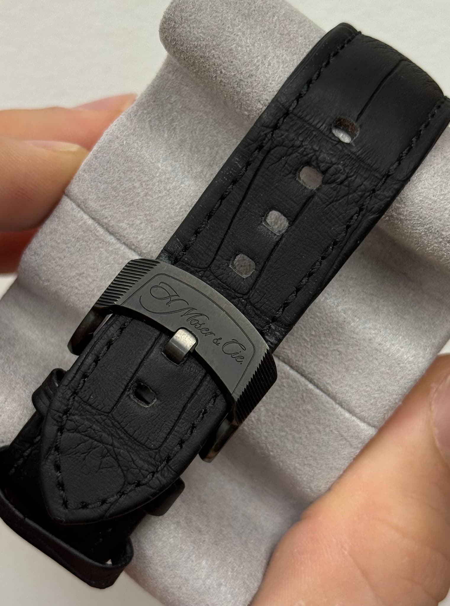 May be an image of leather, saddle-stitched leather and wrist watch
