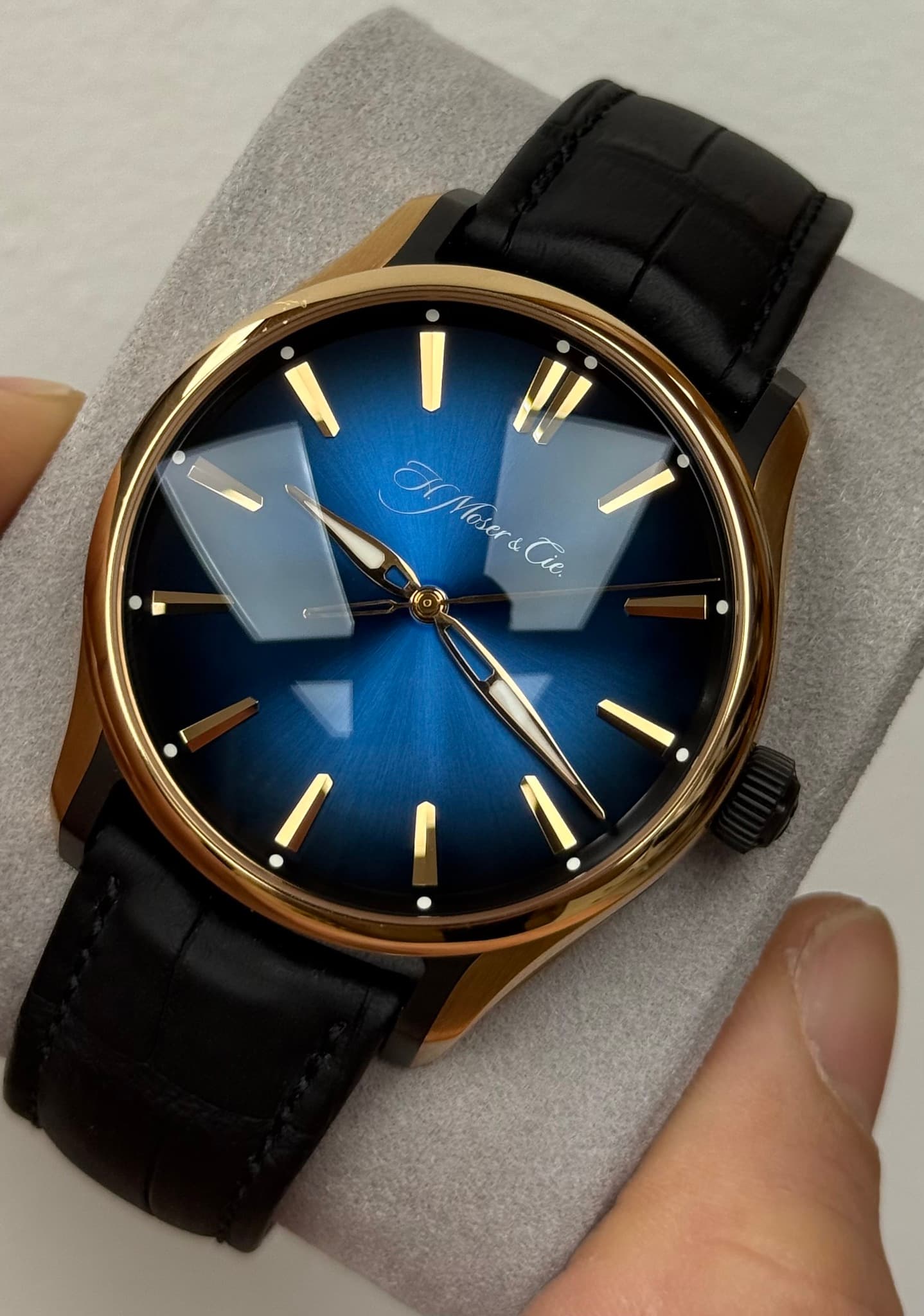May be an image of wrist watch and text