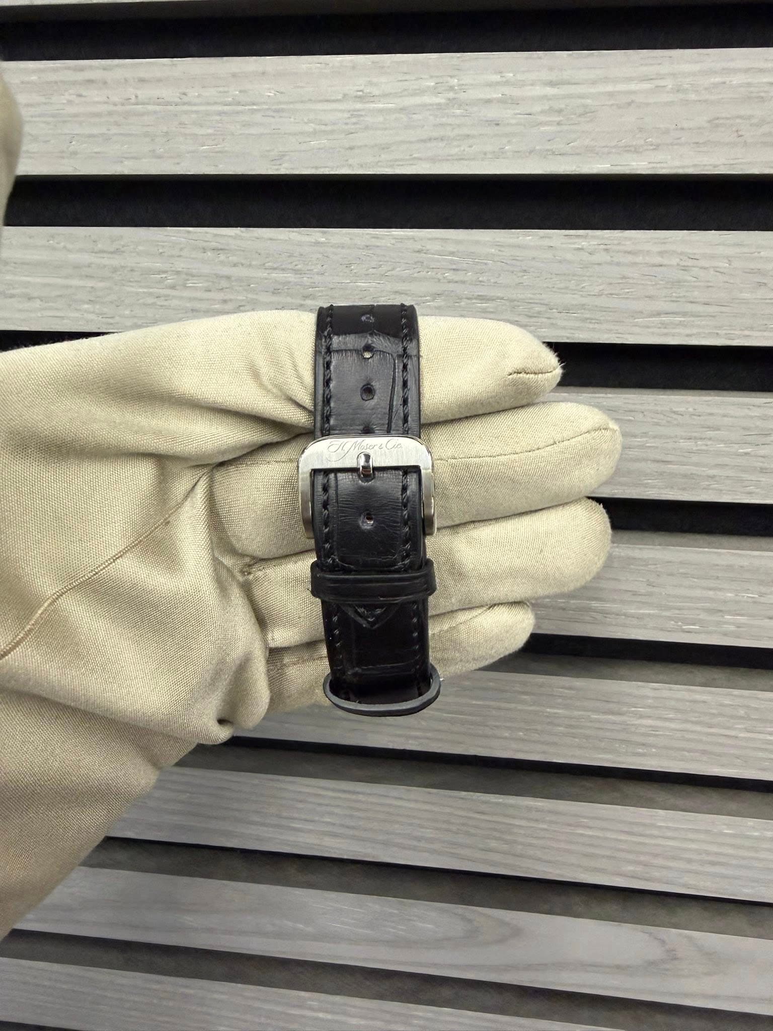 May be an image of leather, saddle-stitched leather and wrist watch