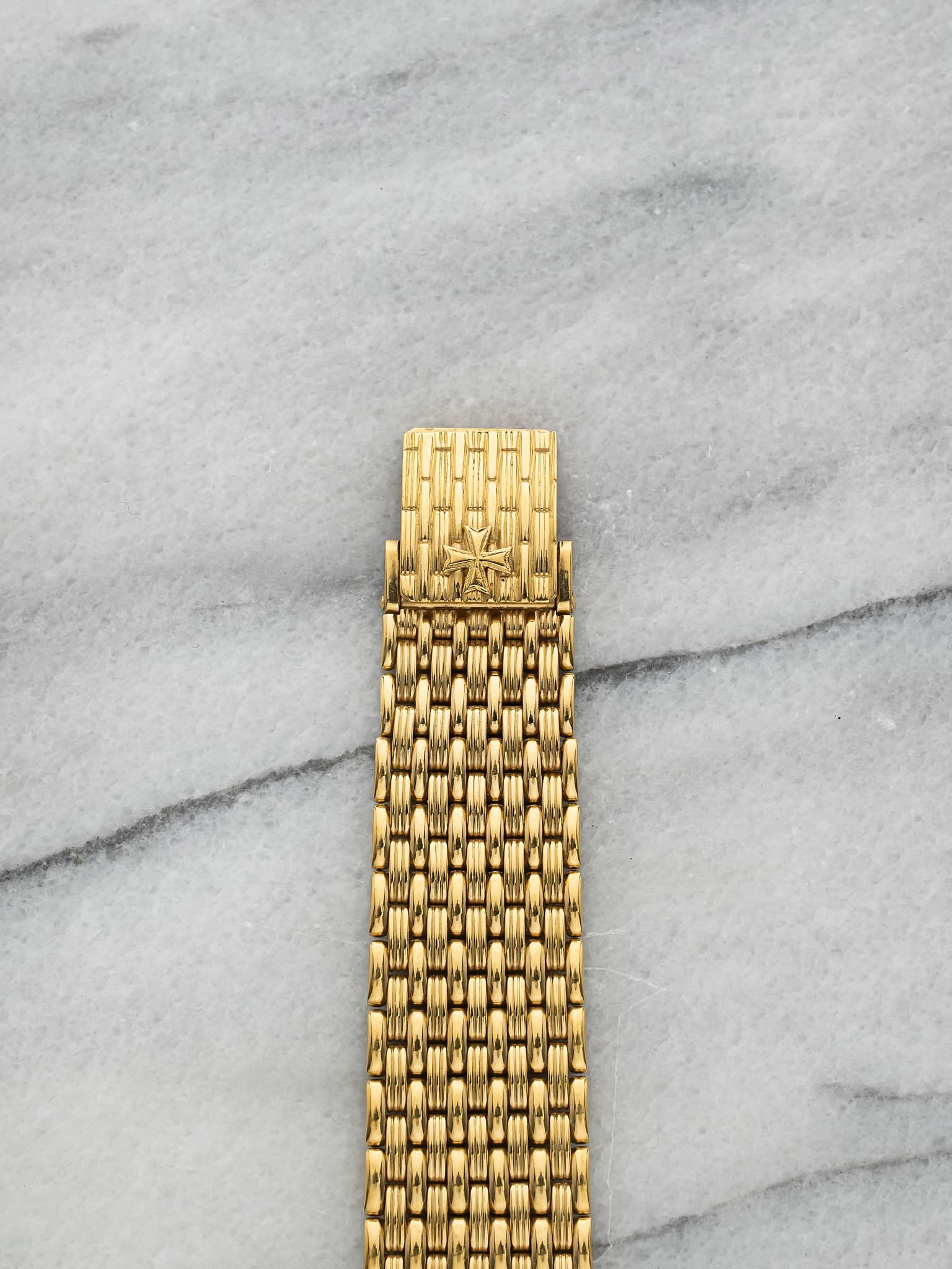 May be an image of wrist watch and jewelry